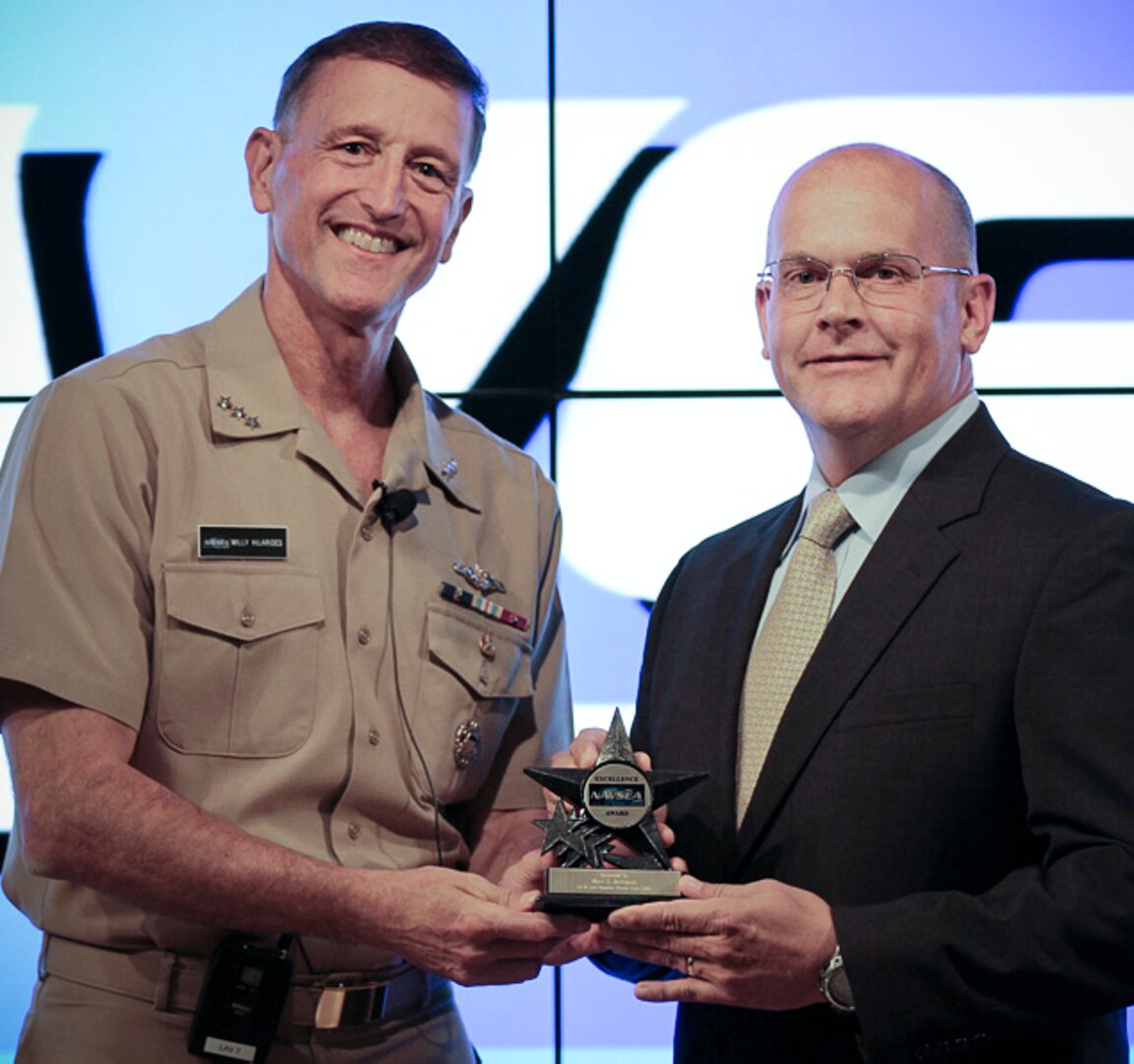 Mark Beckman receives NAVSEA Individual Excellence Award from NAVSEA Commander Vice Adm. William Hilarides during a ceremony, Oct. 27.