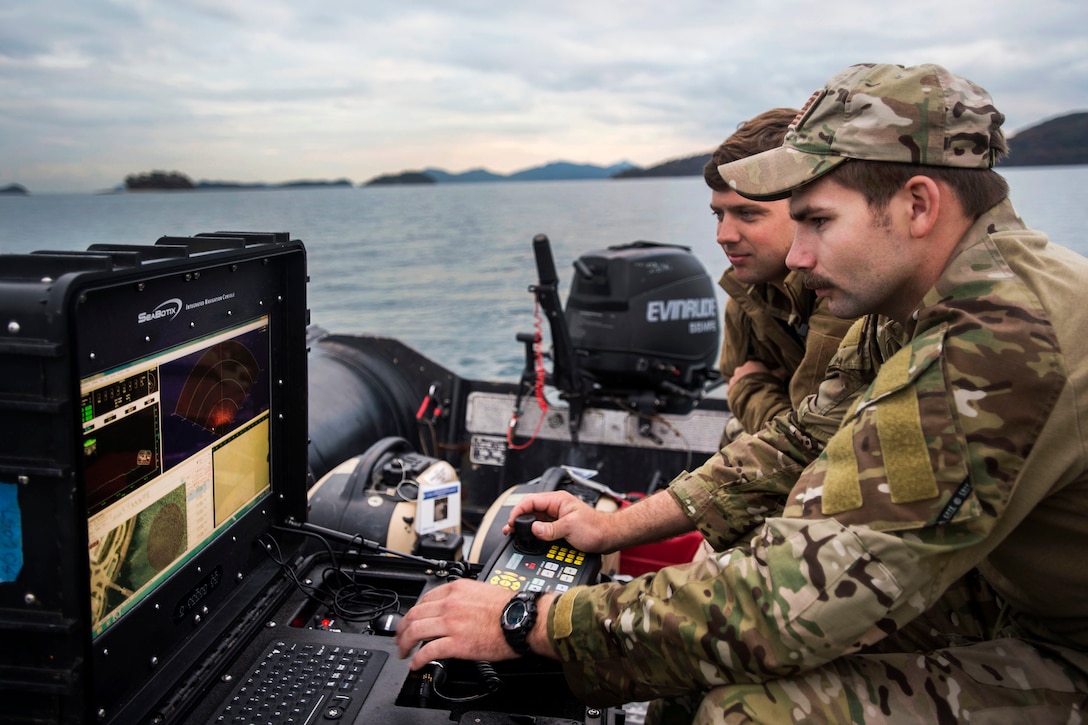U.S. Navy Petty Officers 3rd Class Caden Gene Patrick Olson Johnson, right, and Jay Mawer operate the Seabotix unmanned underwater vehicle during Clear Horizon 2015 on Commander Fleet Activities Chinhae, South Korea, Nov. 9, 2015. Johnson and Mawer are explosive ordnance disposal technicians assigned to Explosive Ordnance Disposal Mobile Unit 5. U.S. Navy photo by Petty Officer 2nd Class Daniel Rolston