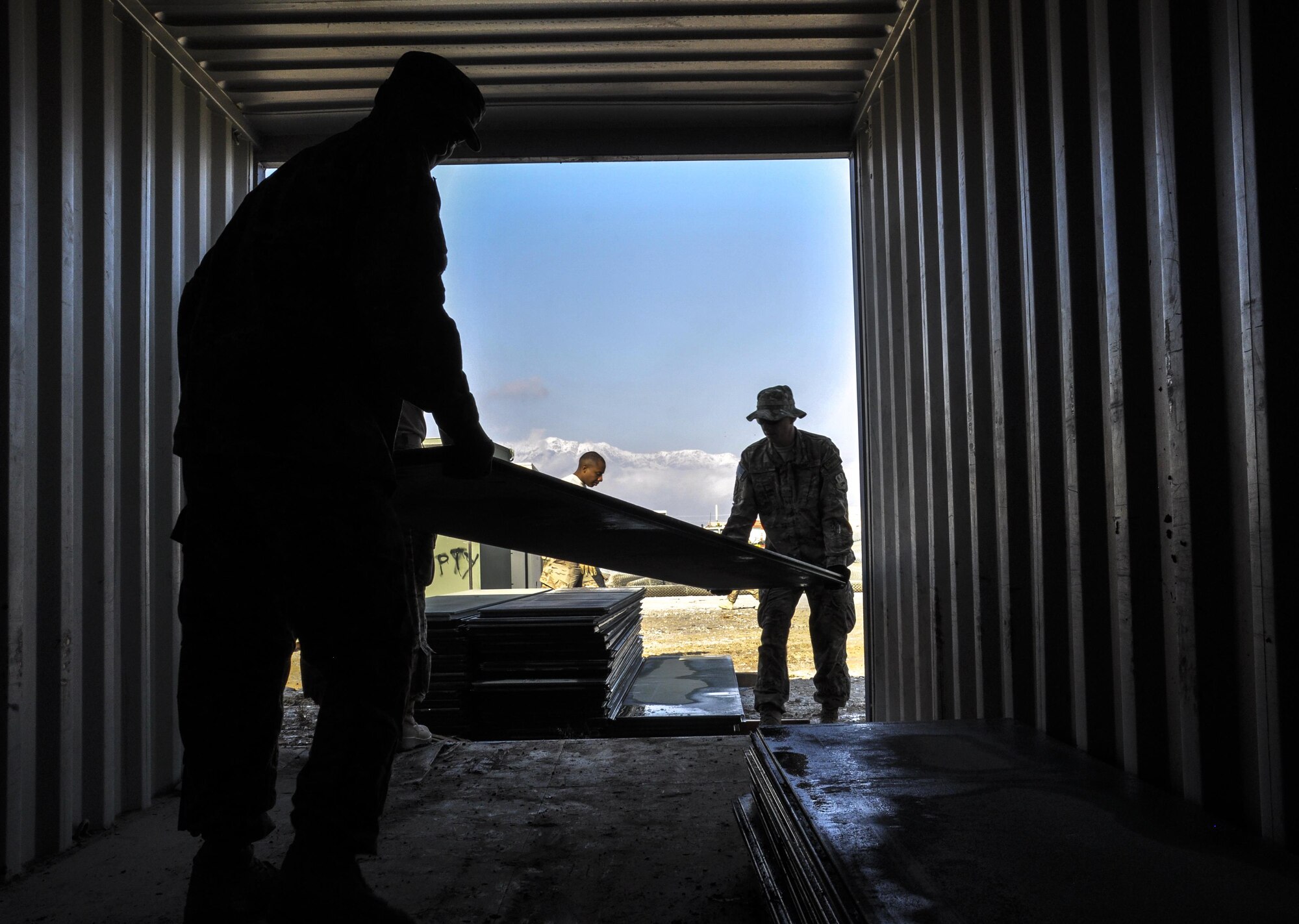 Senior Airman James Weeks, left, Central Command Materiel Recovery Element team member, deployed from Barksdale Air Force Base, La., and Staff Sgt. Christopher Sumner, CMRE team member, deployed from Little Rock AFB, Ark., move aircraft ground paneling into storage for redeployment at Bagram Airfield, Afghanistan, Nov. 13, 2015. The CMRE team is designed to account for and redeploy war reserve assets after they have fulfilled their intended purpose, so they are available for use elsewhere. The team worked numerous hours over six days to manually move 480,852 pounds of material, consolidate 29 shipping containers, and inventory nearly 81,000 square feet of the matting worth $1.5 million. (U.S. Air Force photo by Tech. Sgt. Nicholas Rau/Released)