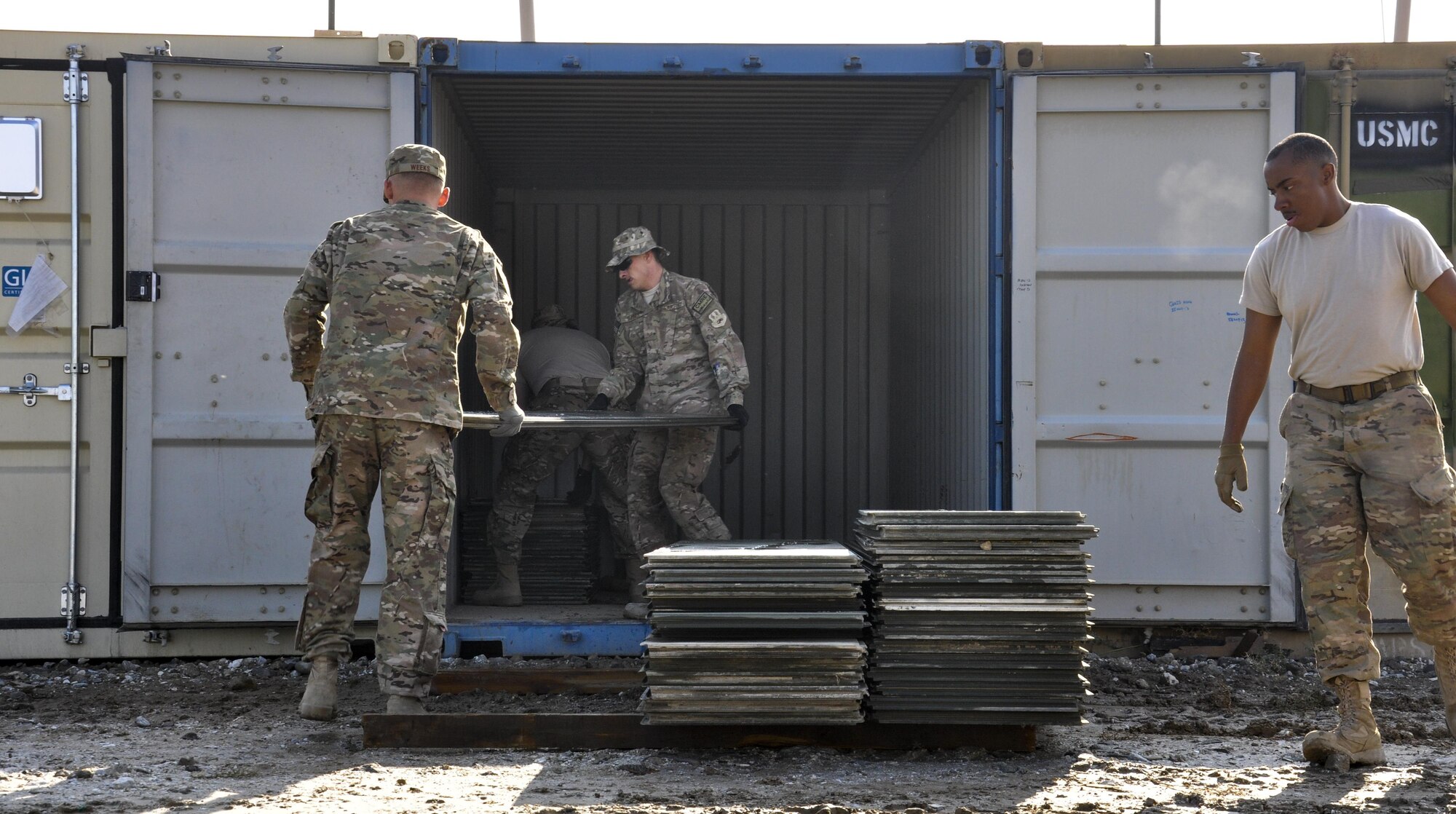 Senior Airman James Weeks, left, Central Command Materiel Recovery Element team member, deployed from Barksdale Air Force Base, La., and Staff Sgt. Christopher Sumner, CMRE team member, deployed from Little Rock AFB, Ark., stack aircraft ground paneling into storage for redeployment at Bagram Airfield, Afghanistan, Nov. 13, 2015. The CMRE team is designed to account for and redeploy war reserve assets after they have fulfilled their intended purpose, so they are available for use elsewhere. (U.S. Air Force photo by Tech. Sgt. Nicholas Rau/Released)