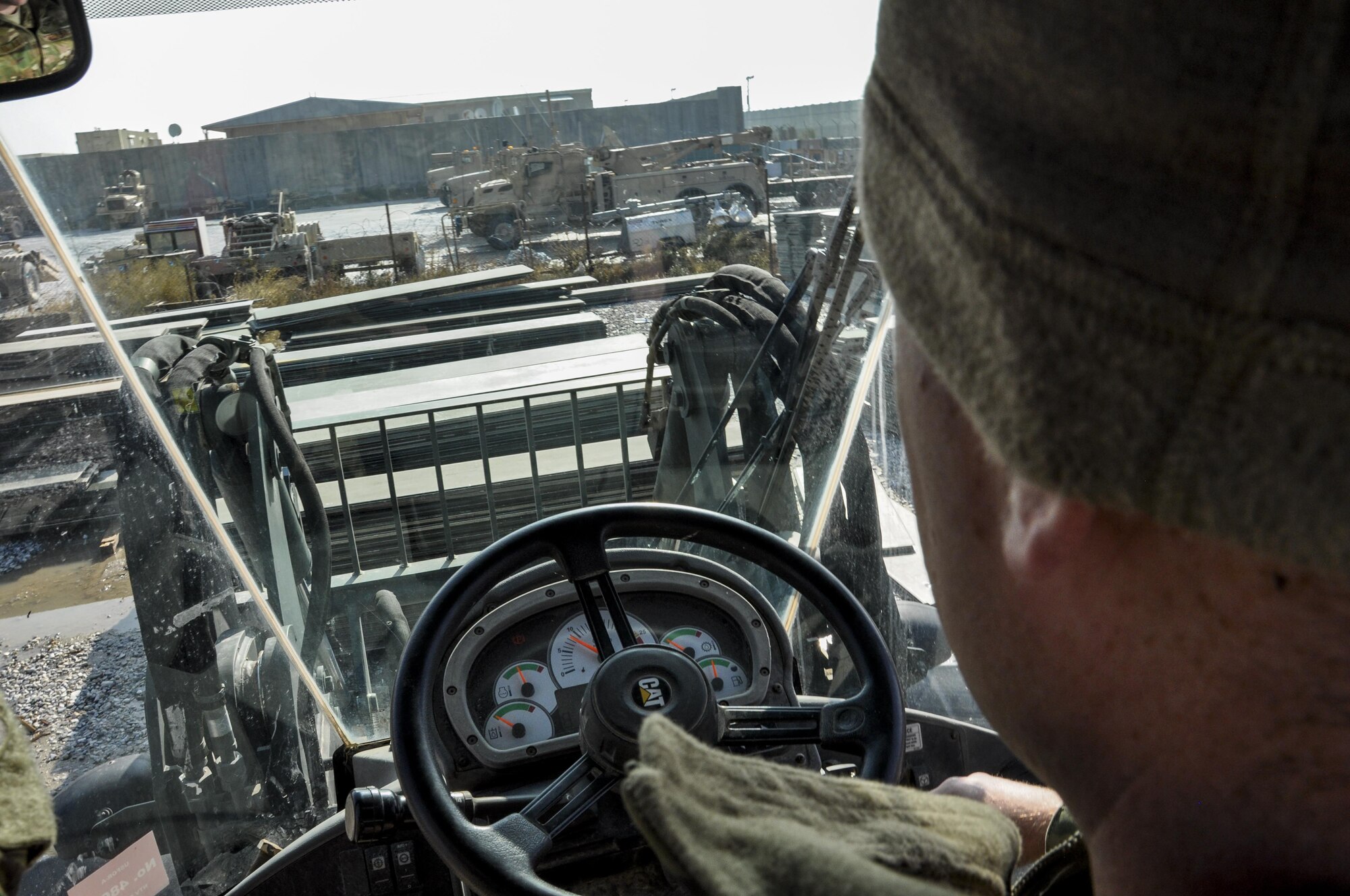 Senior Airman Jack Bragg, right, 455th Expeditionary Logistics Squadron vehicle operator, deployed from Barksdale Air Force Base, La., uses a forklift to reposition aircraft ground paneling into storage for redeployment at Bagram Airfield, Afghanistan, Nov. 13, 2015. The CMRE team is designed to account for and redeploy war reserve assets after they have fulfilled their intended purpose, so they are available for use elsewhere. The team worked numerous hours over six days to manually move 480,852 pounds of material, consolidate 29 shipping containers, and inventory nearly 81,000 square feet of the matting worth $1.5 million. The team worked numerous hours over six days to manually move 480,852 pounds of material, consolidate 29 shipping containers, and inventory nearly 81,000 square feet of the matting worth $1.5 million. (U.S. Air Force photo by Tech. Sgt. Nicholas Rau/Released)