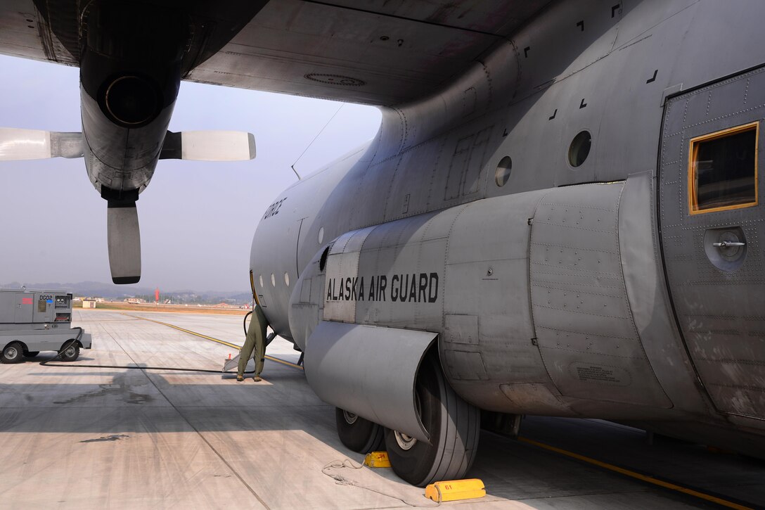 A U.S. Air Force HC-130 Combat King II cargo aircraft sits on Osan Air Base, South Korea, during the loading of simulated aeromedical evacuation patients, Nov. 5, 2015. The aircraft crew, assigned to the Alaska National Guard’s 144th Airlift Squadron, is participating in Vigilant Ace 16, a large-scale exercise designed to enhance combat capabilities and interoperability between the U.S. and South Korea air forces. U.S. Air Force photo by Staff Sgt. Benjamin Sutton