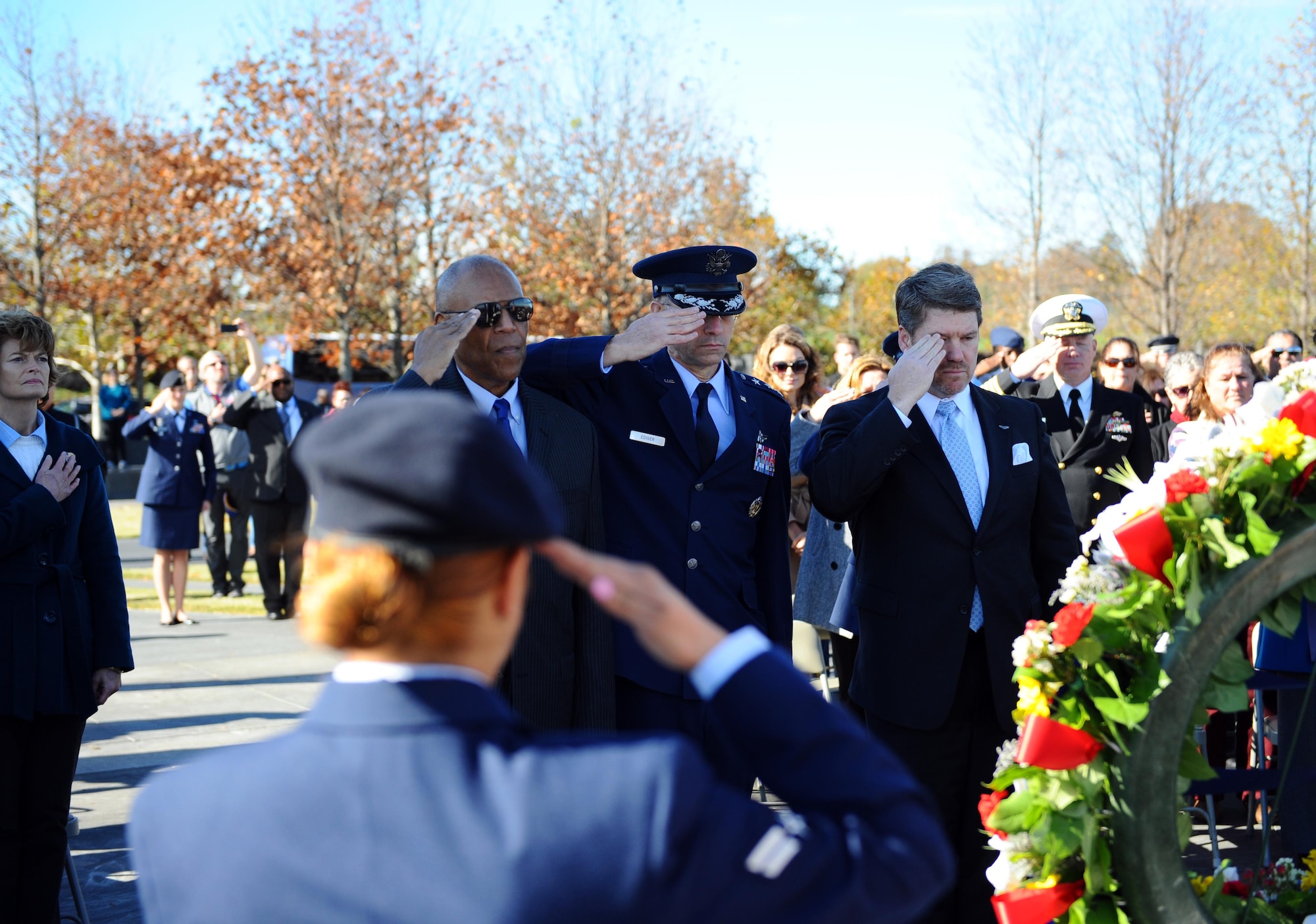 From left to right, retired Gen. Larry O. Spencer, the Air Force Association president; Lt. Gen. Mark A. Ediger, the Air Force surgeon general; and retired Chief Master Sgt. Mark A. Stevenson, the Air Force Sergeants Association chief operating officer, present a salute during a wreath laying ceremony as part of the Veterans Day event at the Air Force Memorial Nov. 11, 2015. (U.S. Air Force photo/Tech. Sgt. Bryan Franks)