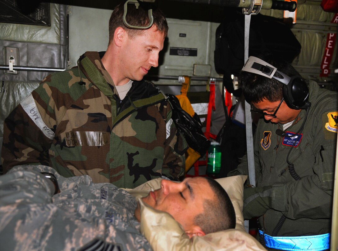 U.S. Air Force Capt. John Stacey, left, and Staff Sgt. Aldwin Gacote strap down a simulated patient during a Vigilant Ace 16 aeromedical evacuation exercise on Osan Air Base, South Korea, Nov. 5, 2015. Stacey is a flight surgeon assigned to the 36th Fighter Squadron and Gacote is a technician assigned to the 18th Aeromedical Evacuation Squadron. U.S. Air Force photo by Staff Sgt. Benjamin Sutton