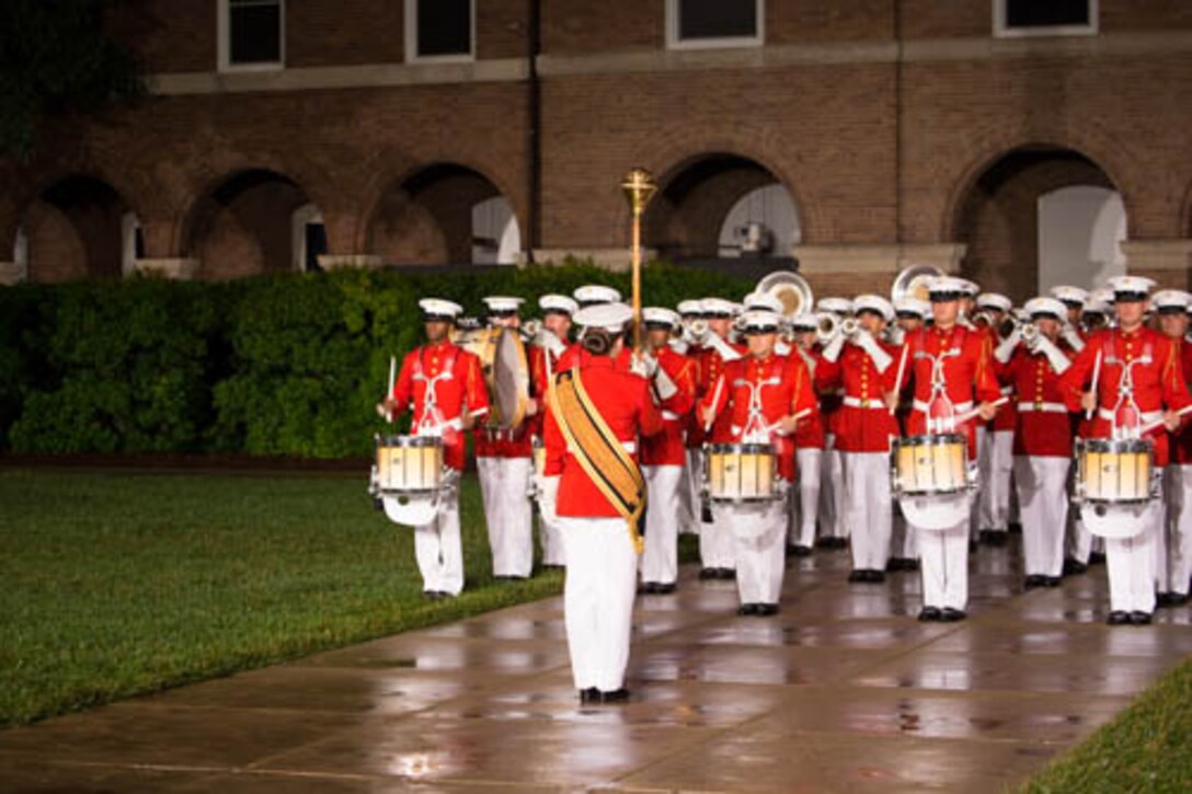 Staff Sergeant Codie Williams leads "The Commandant's Own" as drum major during Sergeant Major James E. Booker's retirement ceremony. (U.S. Marine Corps photo by Staff Sgt. Oscar L. Olive/Released)