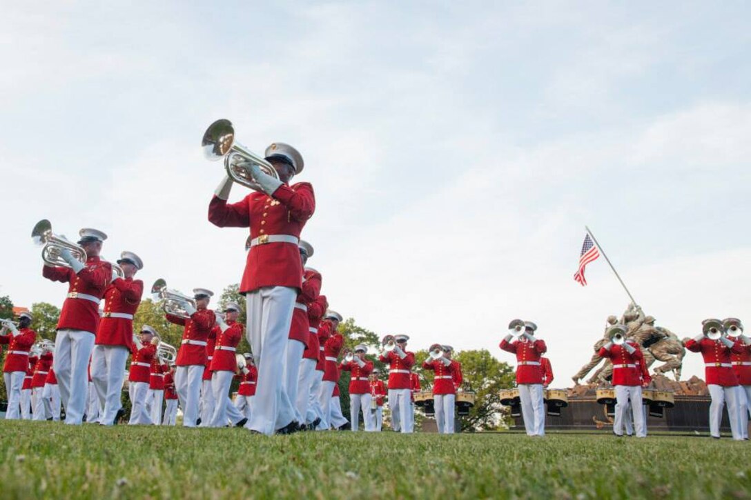 Members of "The Commandant's Own" baritone bugle section perform during the Sunset Parade held in Arlington, Virginia at the Marine Corps War Memorial. (U.S. Marine Corps photo by Lance Cpl. Alejandro Sierras/Released)