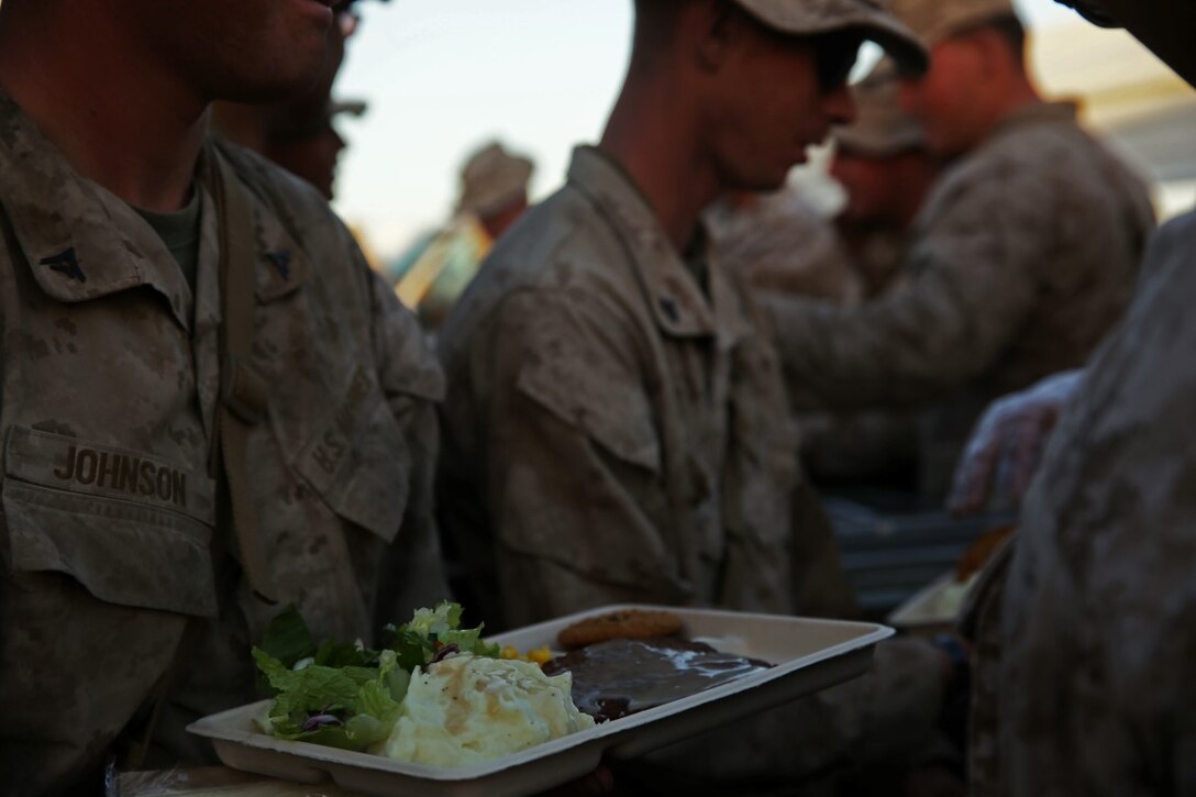 Marines and Sailors assigned to Company A, 3rd Assault Amphibian Battalion, 1st Marine Division, celebrate the Marine Corps’ 240th birthday aboard Yuma Proving Grounds, Ariz., Nov. 10, 2015. The Marines and Sailors celebrated the birthday as a culminating event of the 18-day field operation.