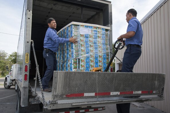 Volunteers offload a pallet of canned vegetables donated to the Val Verde Loaves and Fishes food pantry in Del Rio, Texas, Nov. 12, 2015. Laughlin Air Force Base personnel and their families donated more than 24,000 pounds of food to the pantry as part of the 2015 Feds Feed Families campaign, placing Laughlin in fifth place for total contributions in the Air Force. (U.S. Air Force photo by Staff Sgt. Nathan Maysonet)   