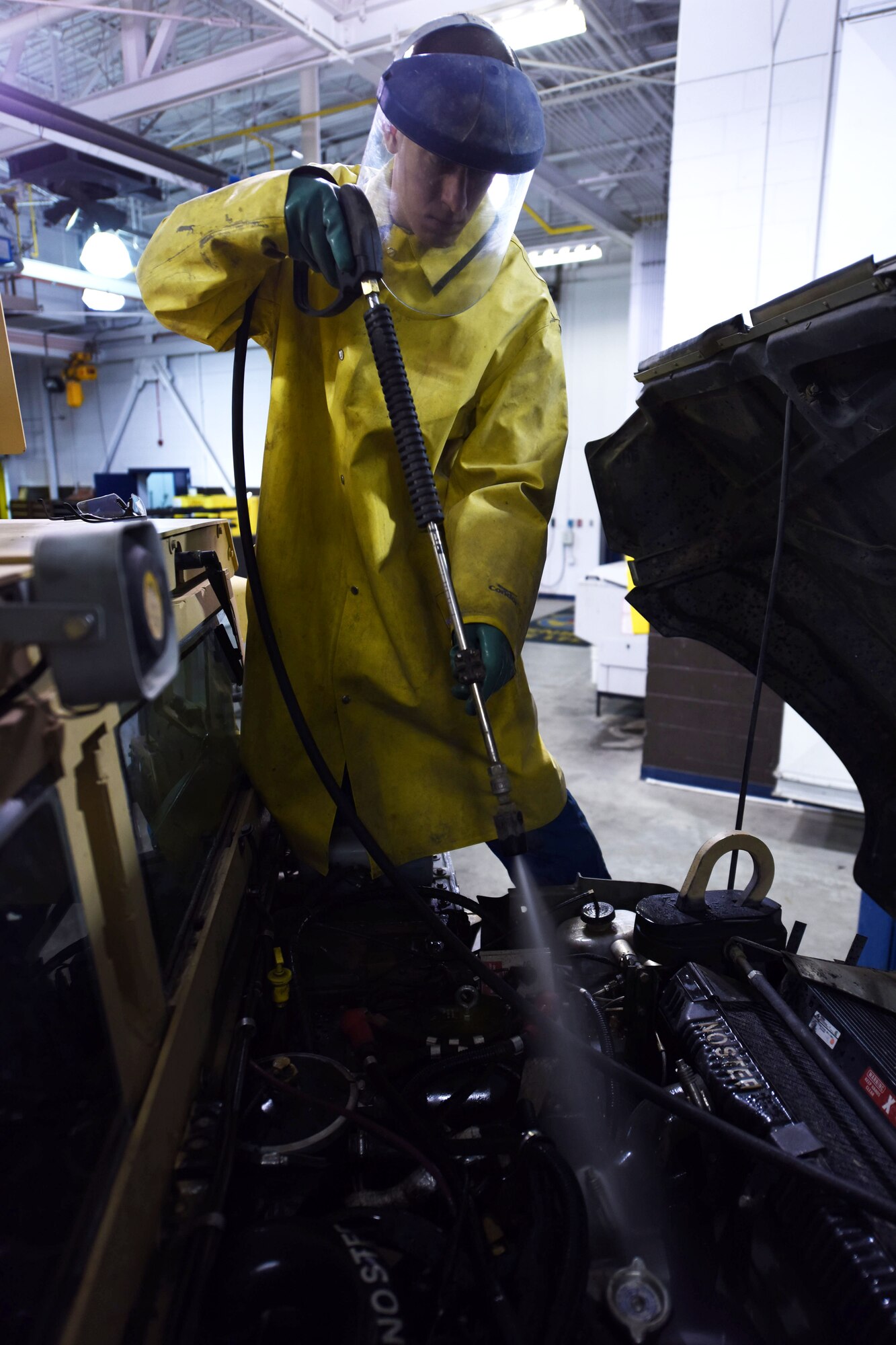 Senior Airman Zachary Simmons, 341st Logistics Readiness Squadron vehicle maintenance journeyman, cleans the engine housing of a Humvee at Malmstrom Air Force Base, Mont., during exercise GLOBAL THUNDER 16, Nov. 6, 2015. The 341st Logistics Readiness Squadron is part of U.S. Strategic Command’s (USSTRATCOM) Task Force 214 and supports the command’s strategic deterrence mission by operating and maintaining the Air Force’s Intercontinental Ballistic Missile force. GLOBAL THUNDER is an annual U.S. Strategic Command training event that assesses command and control functionality in all USSTRATCOM mission areas and affords component commands a venue to evaluate their joint operational readiness. Planning for GLOBAL THUNDER 16 has been under way for more than a year and is based on a notional scenario with fictitious adversaries. USSTRATCOM, one of nine DoD unified combatant commands, relies on various task forces for the execution of its global missions, which also include space operations; cyberspace operations; joint electronic warfare; global strike; missile defense; intelligence, surveillance and reconnaissance; combating weapons of mass destruction; and analysis and targeting. (U.S. Air Force photo by Airman Collin Schmidt)