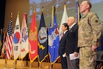 Lt. Gen. Stephen Lanza, I Corps commanding general, retired Maj. Gen. John Hemphill and Consul General Duk-ho Moon, Republic of Korea, stand at attention as the honors to the Korean-era veterans are performed by Battery A, 1-37th FA, 7th Infantry Division during the Korean-era Veterans' Salute at Joint Base Lewis-McChord, Wash., Nov. 13.