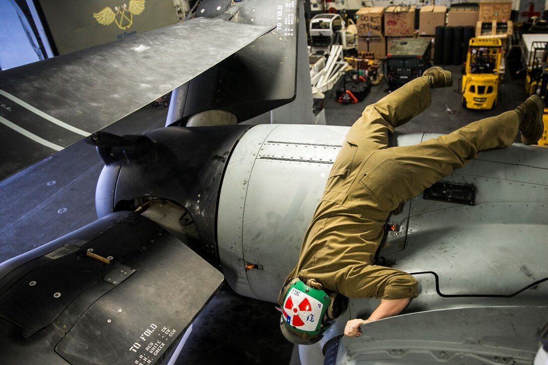 INDIAN OCEAN (Nov. 6, 2015) U.S. Marine Sgt. Taylor Harris performs maintenance on an MV-22B Osprey in the hangar bay of the USS Essex (LHD 2). Harris is a non-destructive inspection technician with Medium Marine Tiltrotor Squadron 161 (Reinforced), 15th Marine Expeditionary Unit. Marines with the MEU’s aviation combat element work together to ensure the aircraft are in good condition and safe to fly. The 15th MEU is currently deployed in the Indo-Asia-Pacific region to promote regional stability and security in the U.S. 7th Fleet area of operations. (U.S. Marine Corps photo by Sgt. Anna Albrecht/Released)
