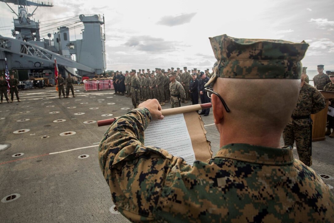 SOUTH CHINA SEA (Nov. 9, 2015) U.S. Marine Gunnery Sgt. Jorge Loera  reads Gen. John A. Lejeune’s birthday message during the Marine Corps birthday ceremony aboard USS Rushmore (LSD 47). Loera is the administrative chief for Combat Logistics Battalion 15, 15th Marine Expeditionary Unit. The 15th MEU is currently deployed in the Indo-Asia-Pacific region to promote regional stability and security in the U.S. 7th Fleet area of operations. (U.S. Marine Corps photo by Sgt. Emmanuel Ramos/Released)