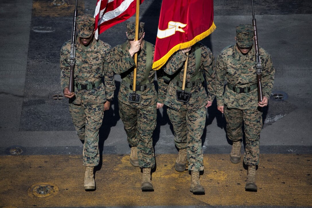 SOUTH CHINA SEA (Nov. 10, 2015) U.S. Marines with the 15th Marine Expeditionary Unit’s color guard march on the colors during a ceremony to celebrate the Marines Corps’ 240th birthday aboard the USS Essex (LHD 2). The ceremony included a reading of Gen. John A. Lejeune’s birthday message and a cake-cutting to celebrate 240 years of tradition, service, and victory. The 15th MEU is currently deployed in the Indo-Asia-Pacific region to promote regional stability and security in the U.S. 7th Fleet area of operations. (U.S. Marine Corps photo by Sgt. Anna Albrecht/Released)