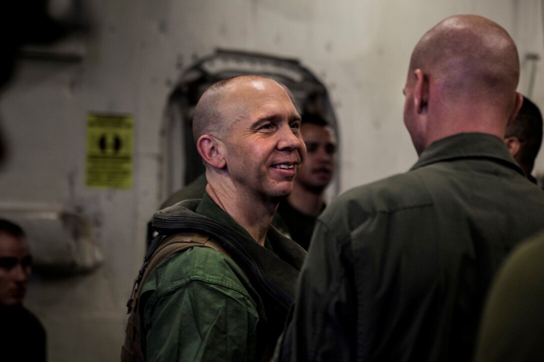 SOUTH CHINA SEA (Nov. 13, 2015) U.S. Marine Lt. Col. Andreas Lavato, right, speaks to Sgt. Maj. Mark D. Wright before loading onto an aircraft aboard the USS Essex (LHD 2). Lavato is the commanding officer and Wright is the sergeant major, both with Medium Marine Tiltrotor Squadron 161 (Reinforced), 15th Marine Expeditionary Unit. The 15th MEU is currently deployed in the Indo-Asia-Pacific region to promote regional stability and security in the U.S. 7th Fleet area of operations. (U.S. Marine Corps photo by Cpl. Elize McKelvey/Released)