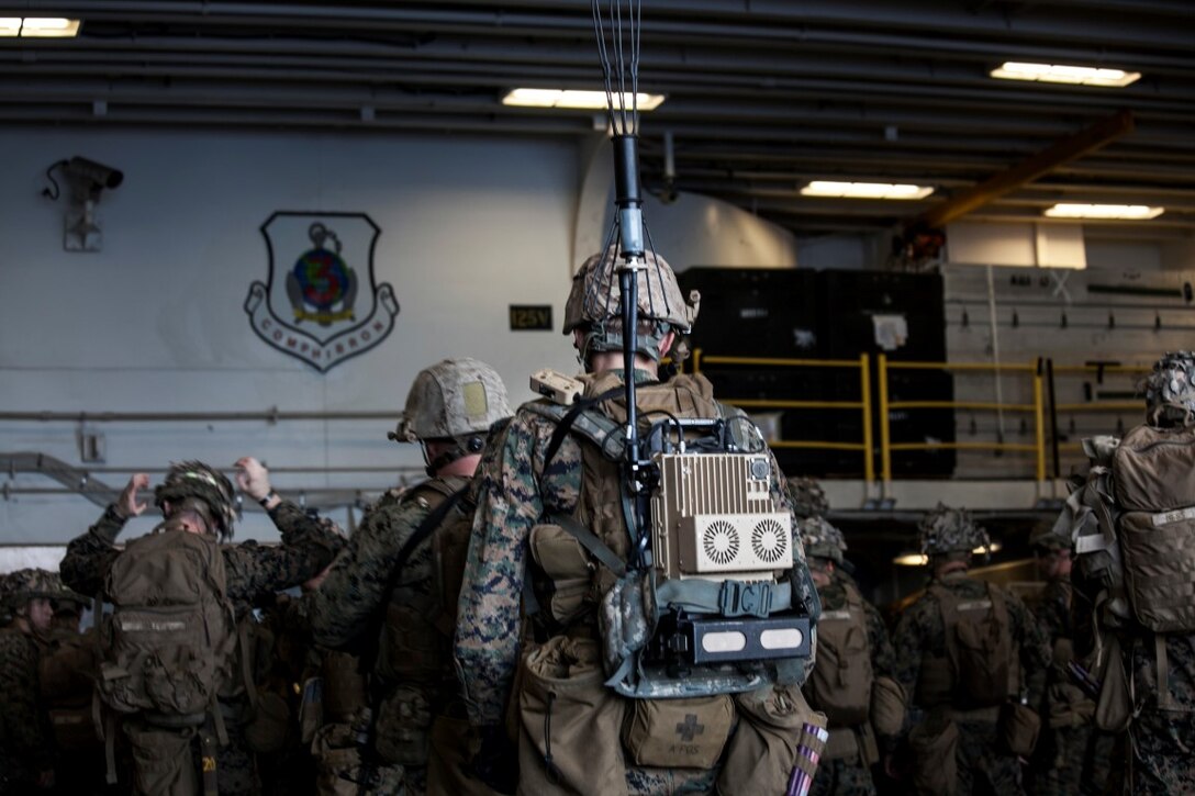 SOUTH CHINA SEA (Nov. 14, 2015) U.S. Marines with Lima Company, Battalion Landing Team 3rd Battalion, 1st Marine Regiment, 15th Marine Expeditionary Unit and Combat Logistics Battalion 15, stage their gear during a quick reaction force rehearsal aboard the USS Essex (LHD 2). The 15th MEU is currently deployed in the Indo-Asia-Pacific region to promote regional stability and security in the U.S. 7th Fleet area of operations. (U.S. Marine Corps photo by Cpl. Elize McKelvey/Released)