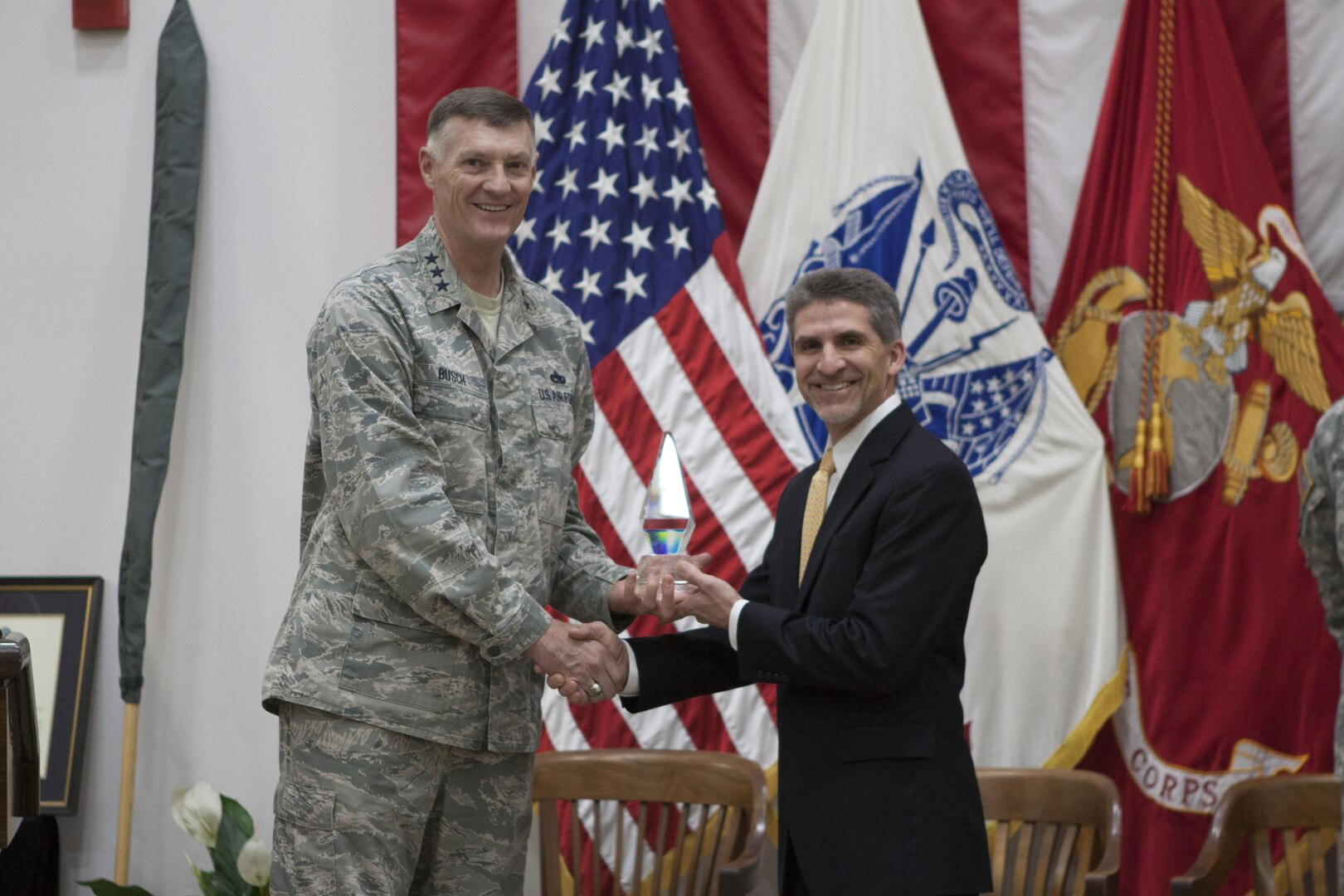 DLA director Air Force Lt. Gen. Andrew E. Busch presents Robert Montefour, site director of Defense Distribution Center, Susquehanna Installation Support the Commander in Chief’s Annual Award for Installation Excellence.