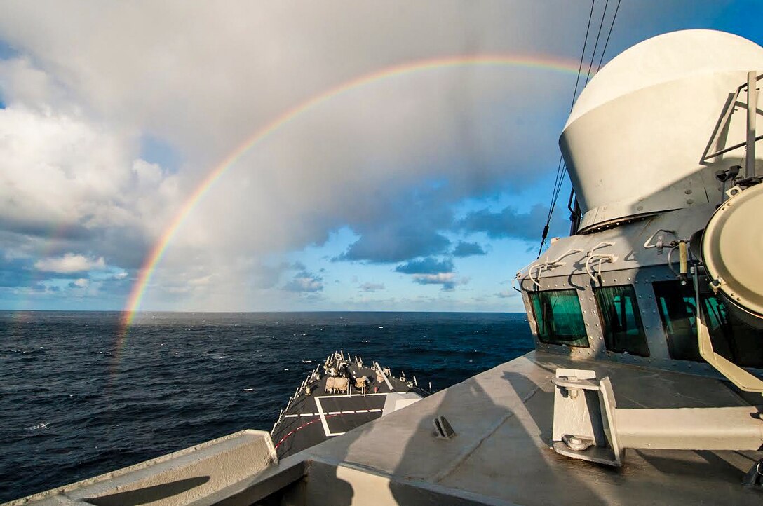 The guided-missile destroyer USS Chung-Hoon sails toward a rainbow in the Pacific Ocean, Nov. 10, 2015. Sailors from the John C. Stennis Strike Group are participating in a sustainment training exercise to prepare for future deployments. U.S. Navy photo by Petty Officer 3rd Class Jonathan Jiang
