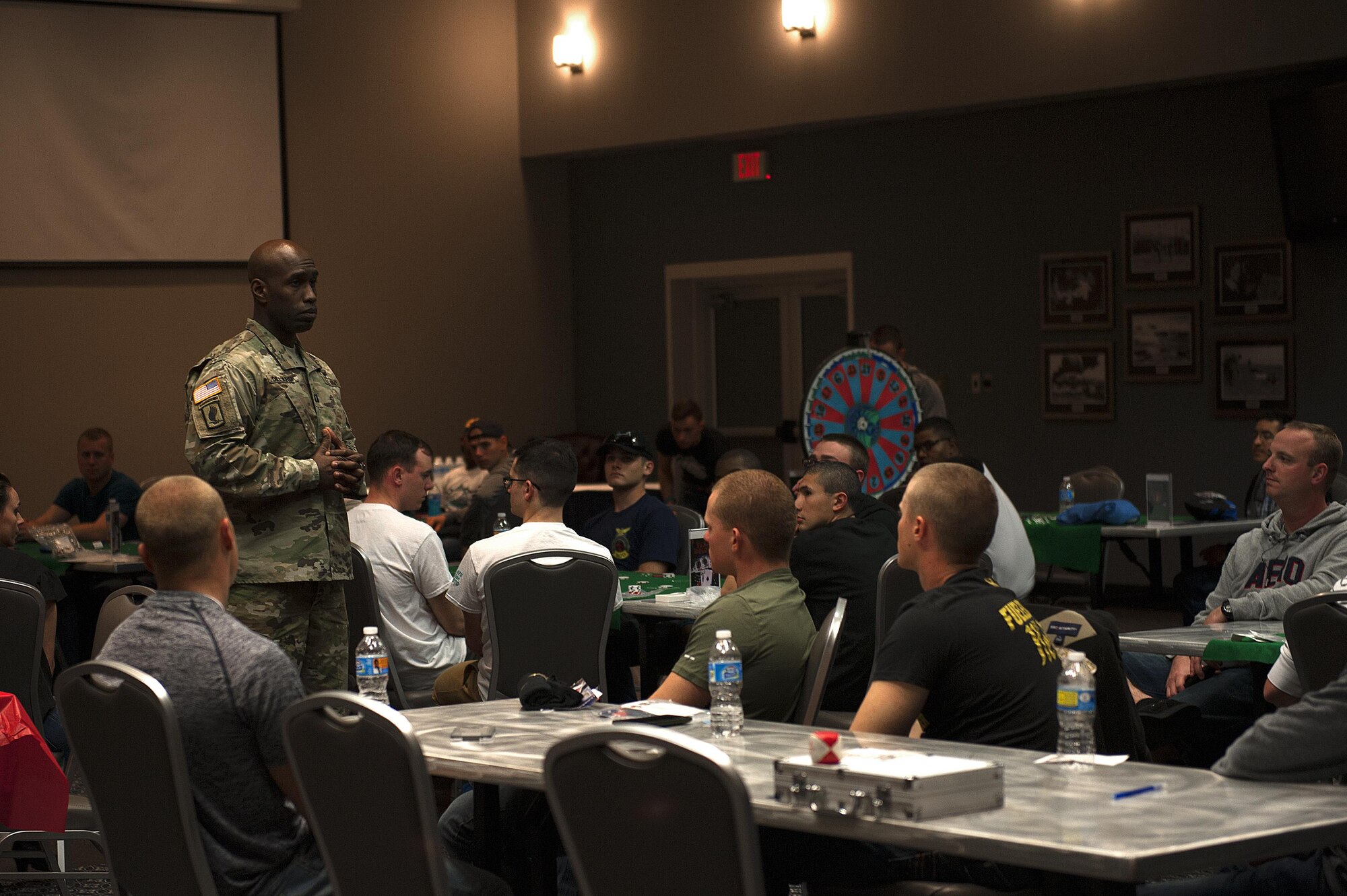 U.S. Army Capt. Jeremy Dillard, 344th Military Intelligence Battalion Alpha Company Commander, shares his experiences and stories about resiliency among comrades during 4th Annual Sexual Assault Prevention and Response Guys Night Out at the Event Center on Goodfellow Air Force Base, Texas, Nov. 12, 2015. Dillard was one of multiple guest speakers to speak about resiliency and sexual assault awareness. (U.S. Air Force photo by Airman 1st Class Caelynn Ferguson/Released)