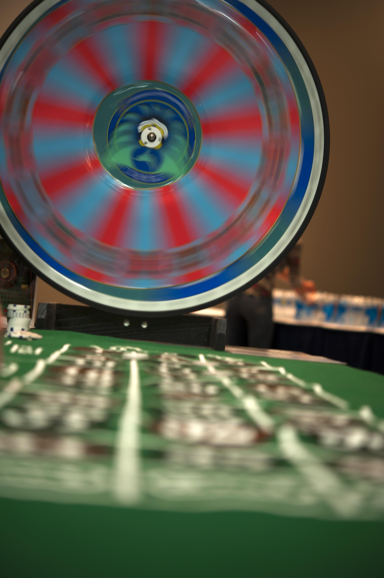 A Big Six wheel spins during a faux casino game during the 4th Annual Sexual Assault Prevention and Response Guys Night Out event at the Event Center on Goodfellow Air Force Base, Texas, Nov. 12, 2015. The event was held by SAPR program officials on base to raise awareness of sexual assault and build resiliency. (U.S. Air Force photo by Airman 1st Class Airman Caelynn Ferguson/Released)