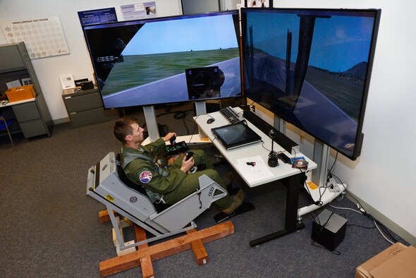 Cadet 1st Class Cody Haggin tests a dynamic motion seat in the Warfighter Effective Research Center at the U.S. Air Force Academy Oct. 23, 2015. Cadets will use the chair to research the effects of simulated motion in advancement of flight proficiency in cadet subjects. (U.S. Air Force Photo/Bill Evans)