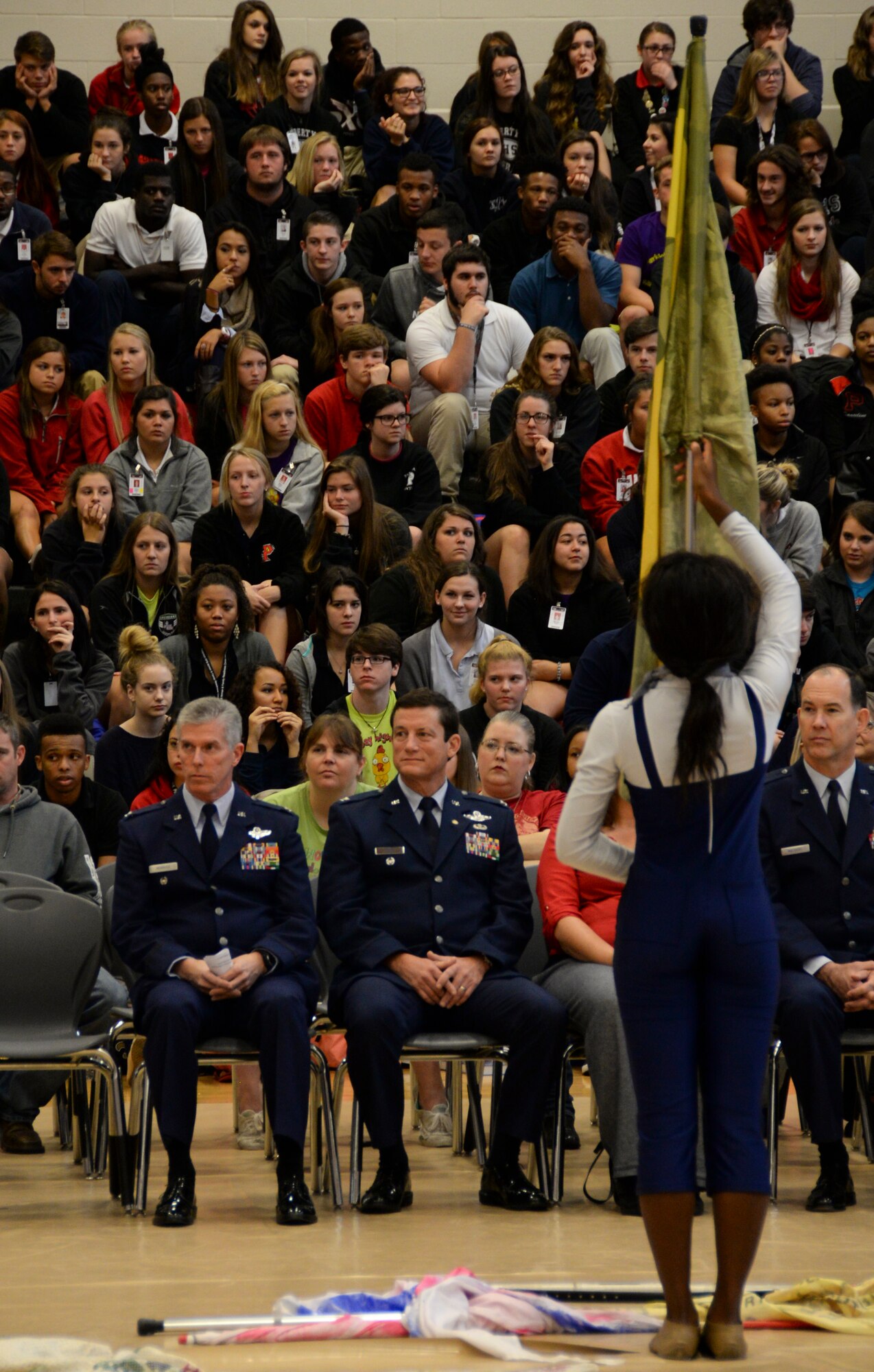 Col. Trey Morriss, retired Col. Russ Mathers and retired Col. Warren Ward, 596th Bomb Squadron Airmen who participated in Operation Senior Surprise, watch a dance line performance during an annual Veterans Day Tattoo Ceremony at Parkway High School in Bossier City, La., Nov. 11, 2015. Operation Senior Surprise was a clandestine mission that helped kick off Operation Desert Storm. Students gave multiple performances during the tattoo including drum corps, band, choir, dance line and service medley. (U.S. Air Force photo/Senior Airman Amanda Morris) 