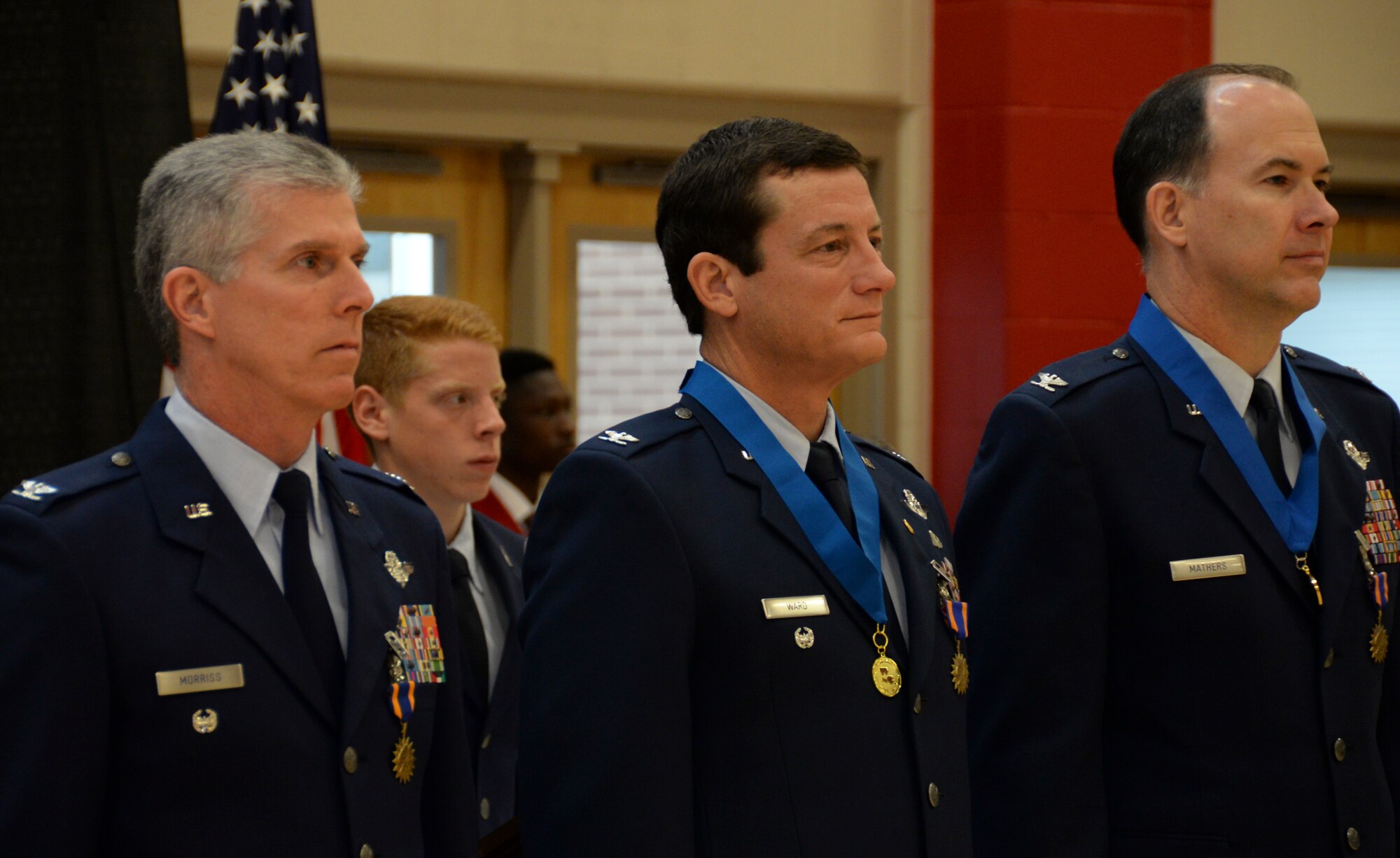 Col. Trey Morriss, retired Col. Russ Mathers and retired Col. Warren Ward, 596th Bomb Squadron Airmen who participated in Operation Senior Surprise, stand proudly after being re-presented with air medals during an annual Veterans Day Tattoo Ceremony at Parkway High School in Bossier City, La., Nov. 11, 2015. Operation Senior Surprise was a clandestine mission that helped kick off Operation Desert Storm. The mission remained classified until Jan 16, 1992, when the crew-members and maintainers who made the mission possible were presented with air, achievement and commendation medals for their efforts. (U.S. Air Force photo/Senior Airman Amanda Morris) 