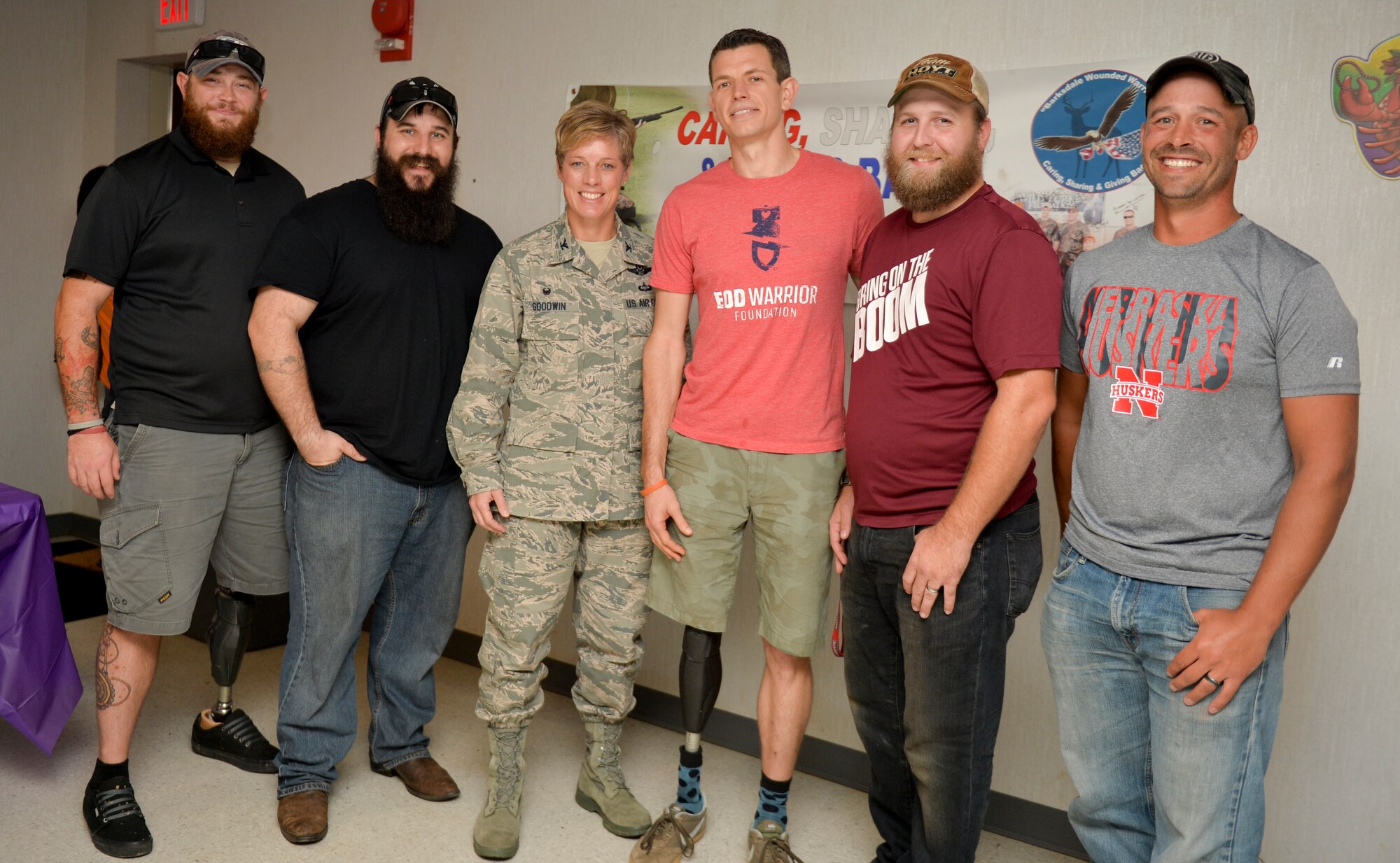 Col. Kristin Goodwin, 2nd Bomb Wing commander, poses for a photo with wounded warriors during the opening ceremony of the 4th Annual Wounded Warrior Hunt at Barksdale Air Force Base, La., Nov. 6, 2015. Barksdale’s Wounded Warrior Foundation, partnered with the Explosive Ordnance Disposal Warrior Foundation, hosted a weekend hunting trip for seven wounded service members to promote rehabilitation, camaraderie and sportsmanship. (U.S. Air Force photo/Airman 1st Class Mozer O. Da Cunha)