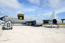 Airmen cover the engines of a KC-135 Stratotanker Nov. 6, 2015, at Andersen Air Force Base Guam. The aircraft is assigned to the 190th Air Refueling Wing, Kansas Air National Guard. (U.S. Air Force photo by Airman 1st Class Arielle Vasquez/Released)