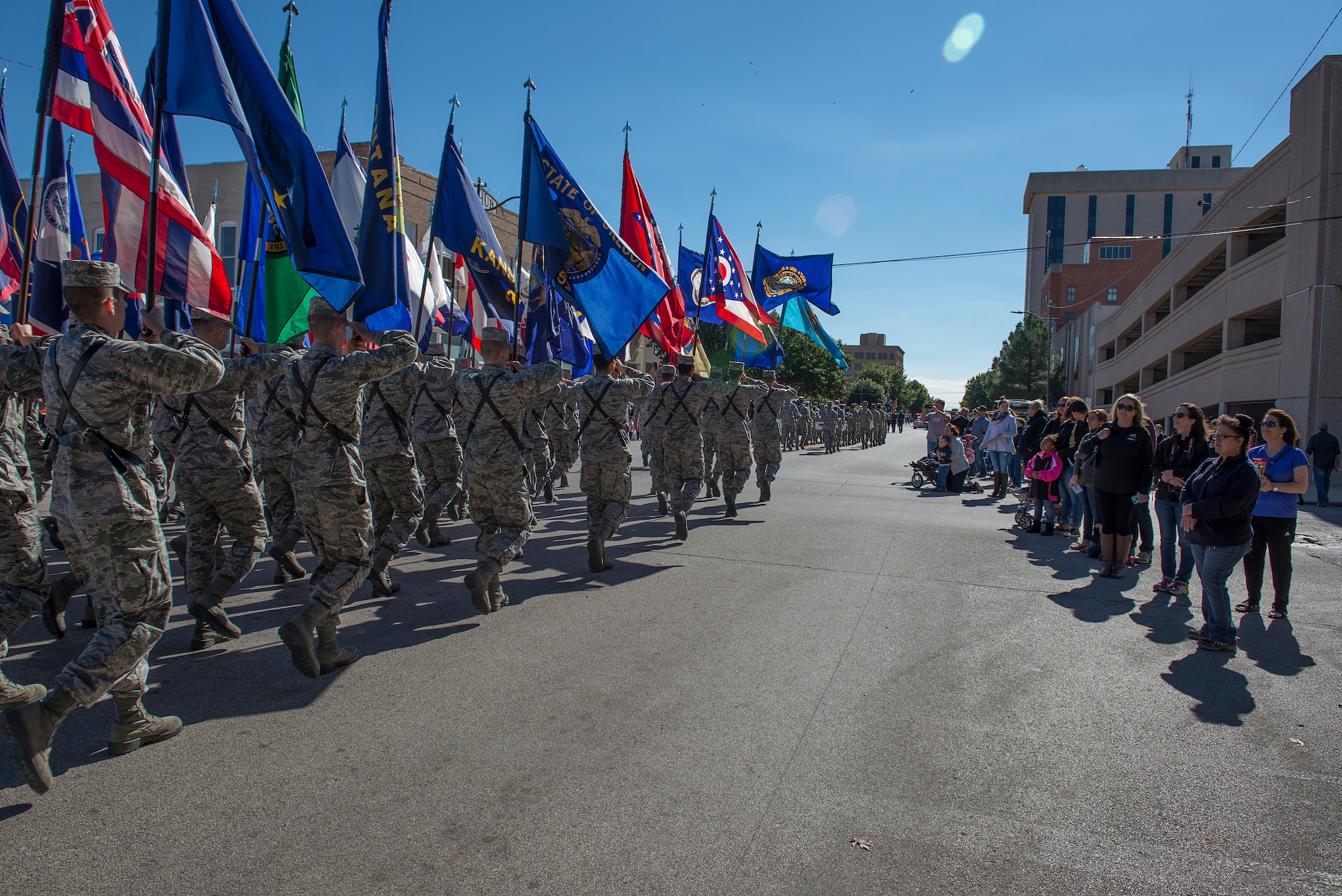Airmen from Sheppard Air Force Base, Texas, march in the Veterans Day parade in downtown Wichita Falls, Nov. 7, 2015. Several flights of Airmen participated in the parade, marching with flags and playing patriotic music for the people of Wichita Falls. (U.S. Air Force photo/Senior Airman Kyle Gese)