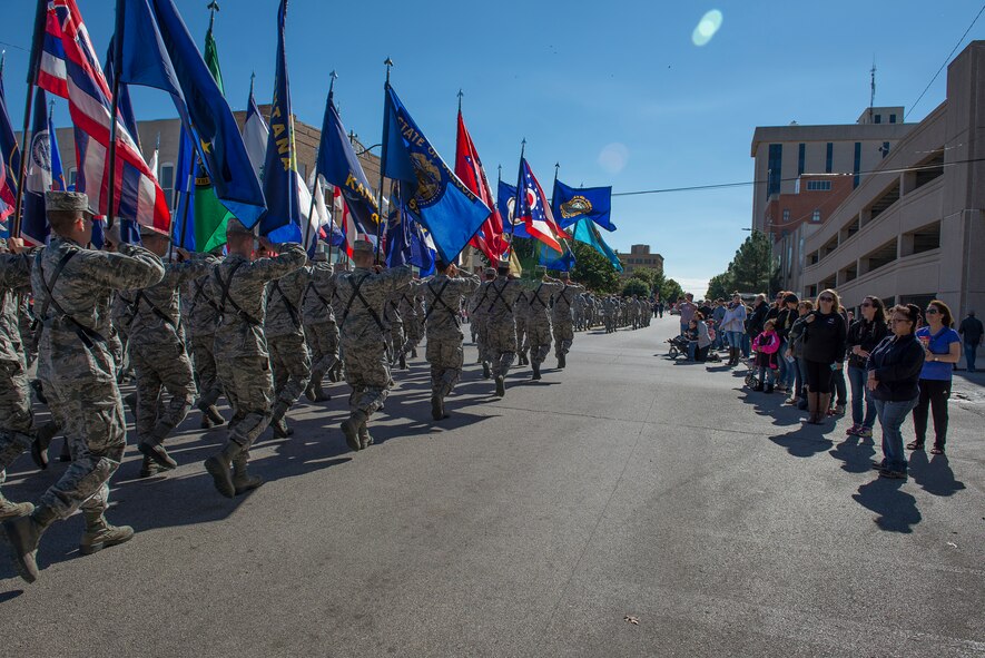 Airmen from Sheppard Air Force Base, Texas, march in the Veterans Day parade in downtown Wichita Falls, Nov. 7, 2015. Several flights of Airmen participated in the parade, marching with flags and playing patriotic music for the people of Wichita Falls. (U.S. Air Force photo/Senior Airman Kyle Gese)