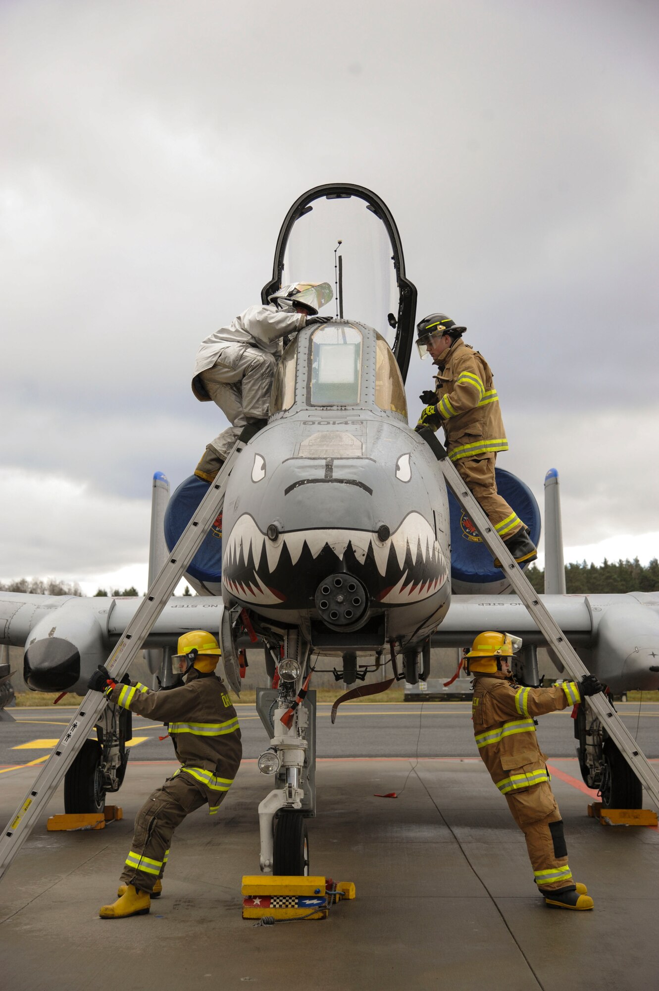 U.S. Air Force and Estonian firefighters simulate egress procedures during a joint-training exercise at Amari Air Base, Estonia, Nov. 11, 2015. The 74th Expeditionary Fighter Squadron firefighters are one of the functions of the Base Operations Support-Integrating team and are deployed from Spangalhem Air Base, as part of a theater security package in support of Operation Atlantic Resolve.  (U.S. Air Force photo by Andrea Jenkins/Released)
