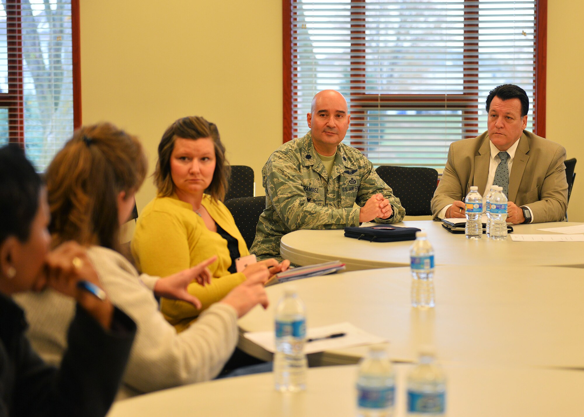 U.S. Air Force Lt. Col. Robert Ramirez, deputy commander of the 55th Operations Group, and Jack Sweet, community support coordinator at Offutt Air Force Base, Neb., listen intently to concerns from military spouses during a spouse focus group meeting at the Pointe in Rising View Housing at Offutt AFB, Neb., Nov. 16, 2015. The group met to discuss ways to provide support for spouses and family members during moves between Offutt and RAF Mildenhall, UK. (U.S. Air Force photo/Senior Airman Rachel Hammes)