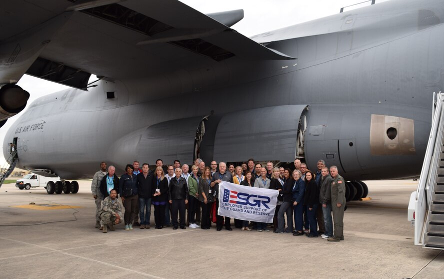 San Antonio employers and members of the 433rd Airlift Wing pose in front of a C-5A Galaxy at the end of the wing’s 2015 Employer Support of the Guard and Reserve Boss Lift Nov. 13, 2015 at Joint Base San Antonio-Lackland. During the two-day trip, participants traveled to Florida where they visited Cape Canaveral Air Force Station and MacDill Air Force Base. (U.S. Air Force photo/Tech. Sgt. Lindsey Maurice)