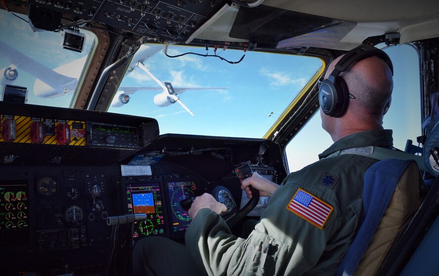 Lt. Col. James Christopher Miller, 433rd Operations Group deputy commander, pilots a C-5A Galaxy during an aerial refueling with an KC-135 from the 931st Air Refueling Group from McConnell Air Force Base, Kanas Nov. 13, 2015. The Galaxy and its passengers were returning to Joint Base San Antonio-Lackland, Texas, from MacDill Air Force Base, Florida, from the 433rd Airlift Wing’s 2015 Employer Support of the Guard and Reserve Boss Lift. (U.S. Air Force photo/Tech. Sgt. Lindsey Maurice)