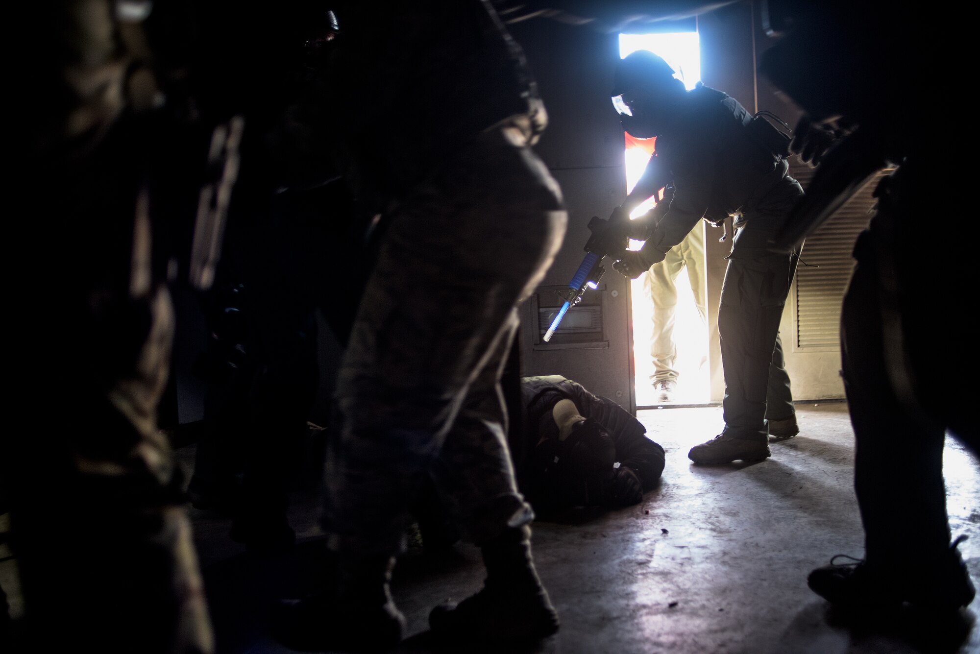 Airmen from the Will Rogers Air National Guard Base in Oklahoma City, and Oklahoma law enforcement officers neutralize a threat to save a hostage at a fire training center in Edmond during a Special Weapons and Tactics school held by the Oklahoma County Sheriff’s Office, Oct. 26 to Nov. 6, 2015. Oklahoma Air National Guard Airmen and six other state agencies executed precise joint operations and procedures that may one day be used to save lives in real-world situations. (U.S. Air National Guard photo by Master Sgt. Andrew M. LaMoreaux)
