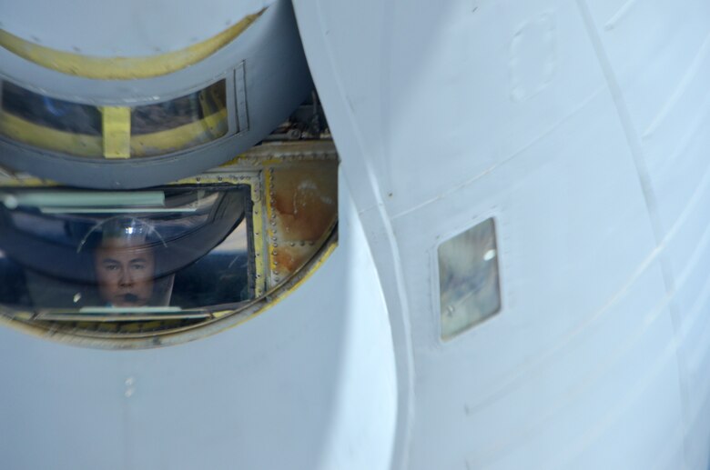 With intense focus, Staff Sgt. Kevin Gimenez, an Arizona Air National Guard KC-135 Stratotanker boom operator, refuels a NATO E-3A Sentry over northern Germany during a training mission Nov. 16. Airmen from the 161st Air Refueling Wing based in Phoenix are supporting aircrew training operations Nov. 9-20 at NATO Air Base Geilenkirchen, Germany. (U.S. Air National Guard photo by Lt. Col. Gabe Johnson)