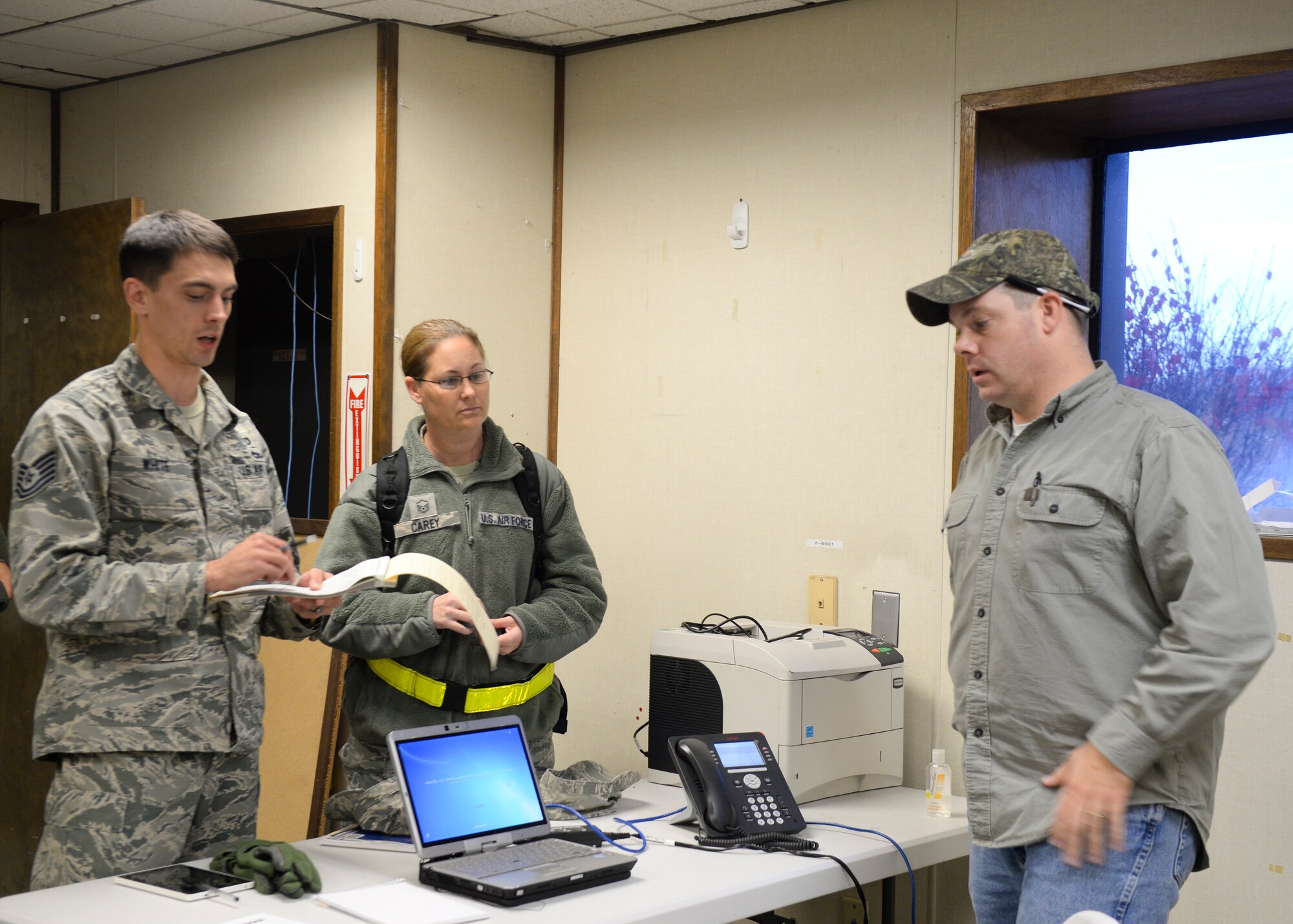 Tech Sgt. David White, 22nd Contracting squadron, contract specialist and Master Sgt. Tonya Carey, 22nd Comptroller Squadron quality assurance manager speak with Fairchild Airmen to acquire needed items such as cots for the duration of their visit to Fairchild Air Force Base, Wash. Nov. 2 - 8, 2015. Units such as the 22nd and 92 Air refueling wings used their day to day mission capabilities of air refueling to enable USSSTRATCOM to conduct global combat and reconnaissance operations. (U.S. Air Force photo by 2nd Lt Krystal Jimenez)