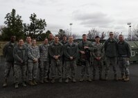 Col. Bruce Heseltine, 22nd Air Refueling Wing vice commander the takes a photo with the outstanding performers from the 22nd and 92nd Air Refueling Wings. The 22nd ARW teamed up with the 92nd ARW to use their day to day mission capabilities of air refueling to enable USSSTRATCOM to conduct global combat and reconnaissance operations November 2 - 8, here and at Fairchild Air Force Base, Wash. (U.S. Air Force photo by 2nd Lt Krystal Jimenez)