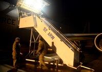 Maintenance Airmen from the 22nd Air Refueling Wing greet incoming aircrew using assets provided by the 92nd ARW to include air stairs. The 22nd ARW teamed up with the 92nd ARW and used their day to day mission capabilities of air refueling to enable USSSTRATCOM to conduct global combat and reconnaissance operations.  (U.S. Air Force photo by 2nd Lt Krystal Jimenez)