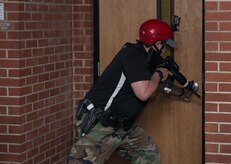 A law enforcement officer prepares to breach a door during an active shooter exercise at the Federal Law Enforcement Training Center in Charleston, S.C., on Nov. 5, 2015. The active shooter training program is a four day course to help law enforcement officers better handle an actual active shooter situation. (U.S. Air Force photo/Airman 1st Class Thomas T. Charlton)