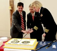 Scott Isaaks, left, director of Ralph H. Johnson Veterans Administration
Medical Center, the Department of Veterans Affairs Deputy Secretary Sloan D.
Gibson, center, and Capt. Elizabeth Maley, commanding officer of Naval
Health Clinic Charleston, cut the cake during a ceremony Nov. 10 at NHCC
celebrating the 5th anniversary of the grand opening of Naval Health Clinic
Charleston and the Charleston Veterans Administration's Goose Creek
Community Based Outpatient Clinic. (Navy photo/ Hospitalman Mark Simon)
