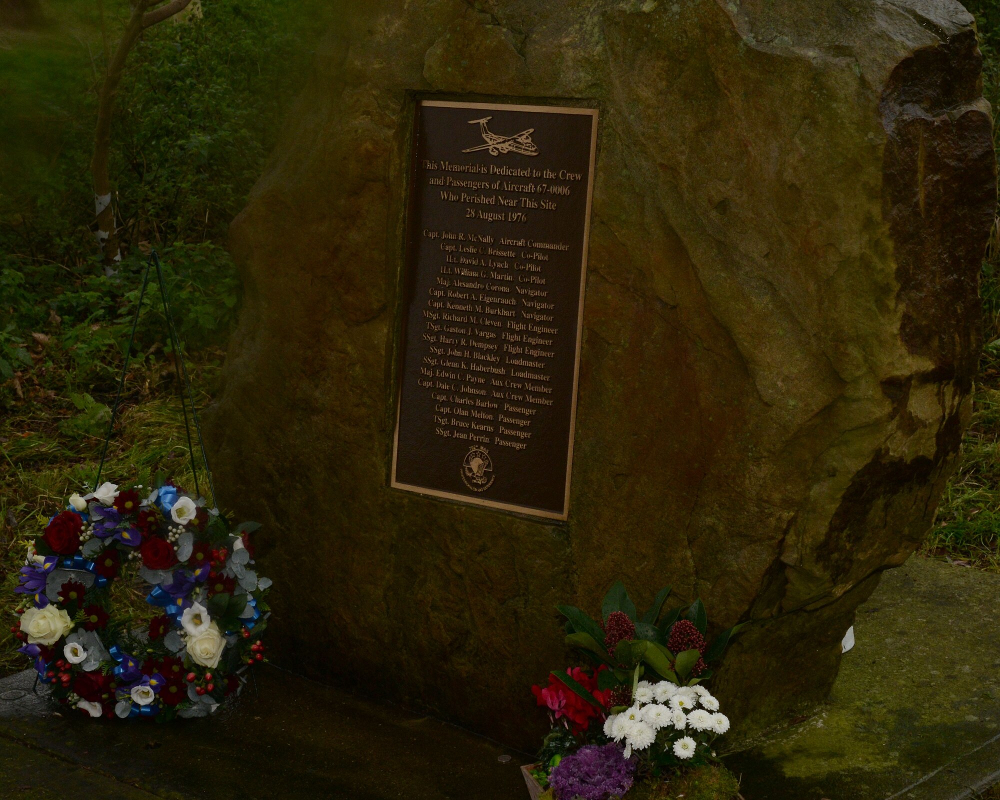 Fresh flowers and a wreath lie at an aircraft crash memorial Nov. 14, 2015, near Peterborough, England. U.S. Air Force Airmen from RAF Mildenhall, England, dedicated a weekend morning to clean the Thorney Dyke memorial. The memorial was dedicated to the Airmen who lost their lives Aug. 28, 1976, when a U.S. Air Force C-141A Starlifter, assigned to the 438th Military Airlift Wing at McGuire Air Force Base, New Jersey, crashed during a thunderstorm on approach to RAF Mildenhall. (U.S. Air Force photo by Airman 1st Class Justine Rho/Released)
