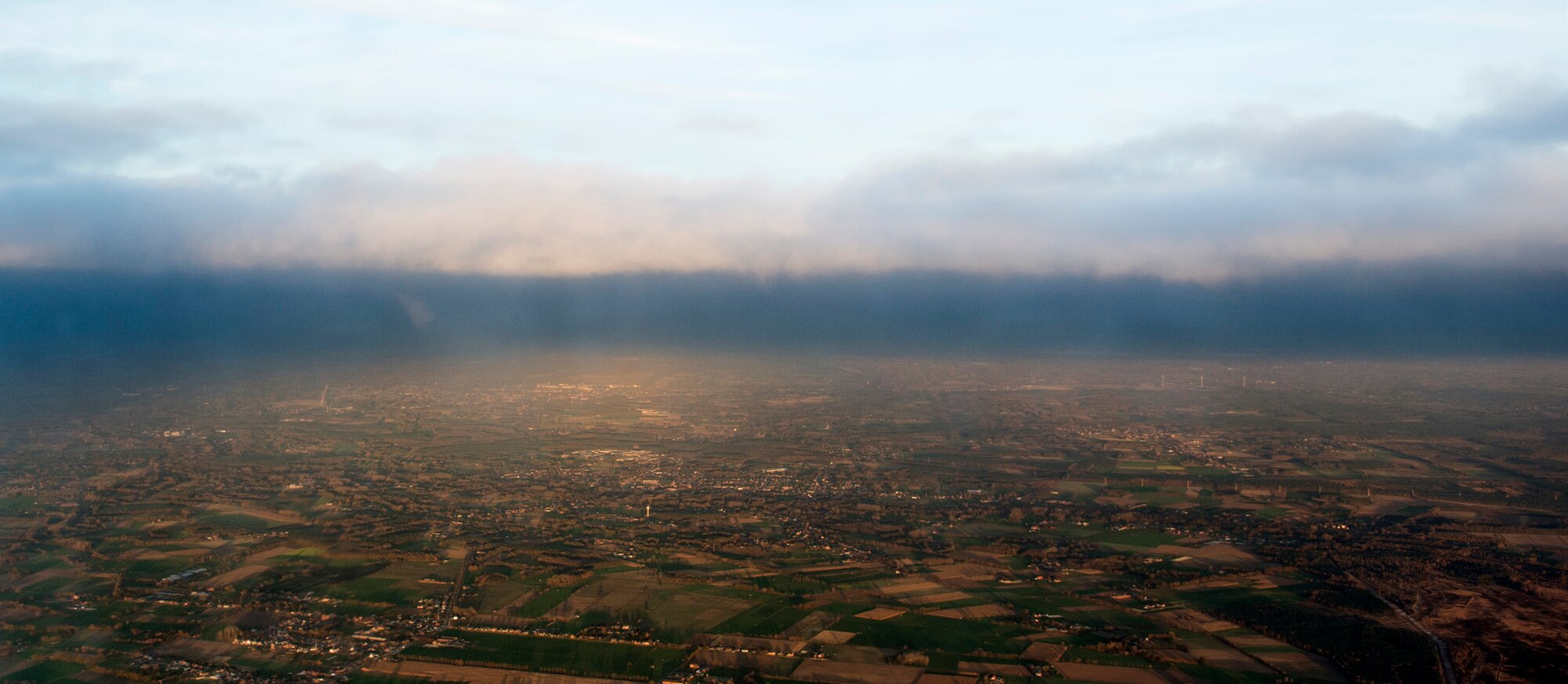 The sun sets over the Belgium landscape as seen through a window of a U.S. Army UH-60 Black Hawk helicopter, assigned to the 1st Battalion, 214th Aviation Regiment, Nov. 12, 2015. Members of Spangdahlem Air Base, 701st Munitions Support Squadron and Belgian air force participated in the readiness training. (U.S. Air Force photo by Senior Airman Rusty Frank/Released)
