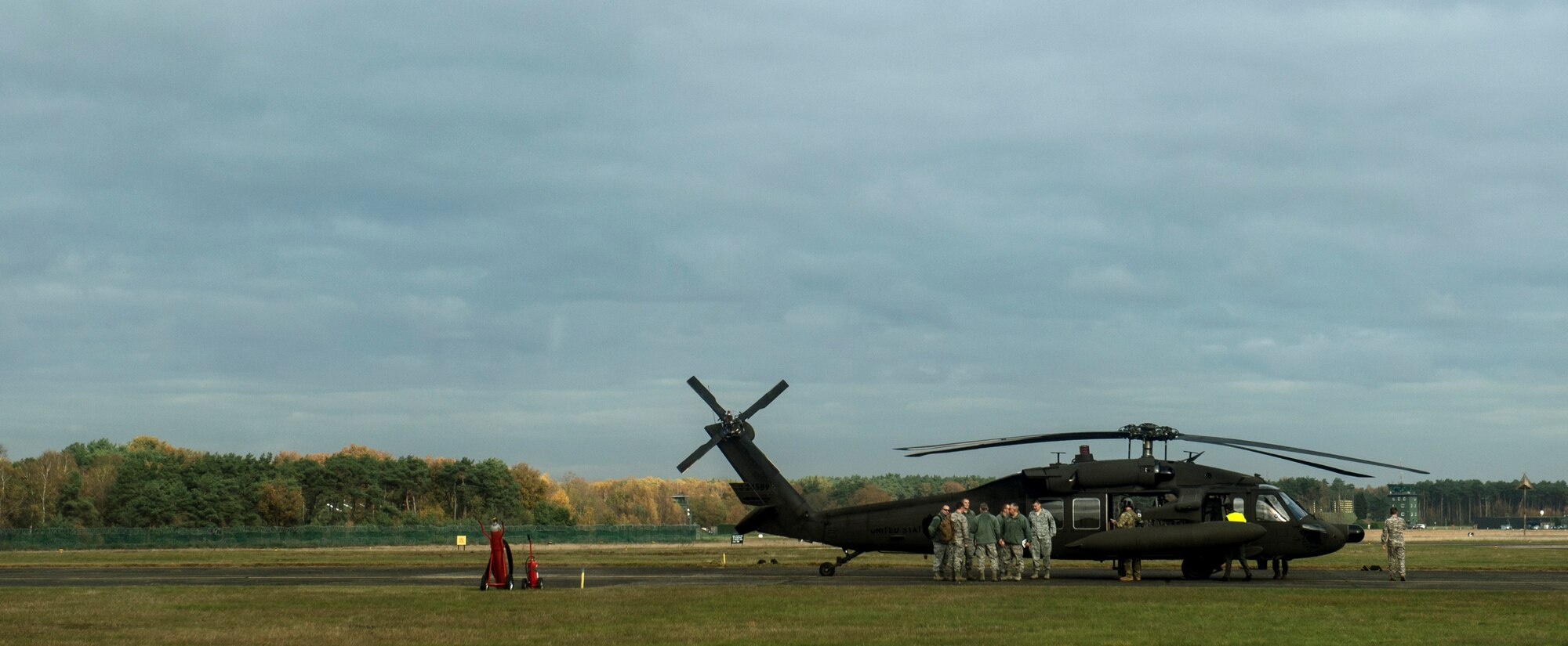 Spangdahlem Airmen stand outside a UH-60 Black Hawk helicopter on the flight line at Kleine Brogel Air Base, Belgium, during a training event Nov. 12, 2015. The Airmen from Spangdahlem trained with members of the 701st Munitions Support Squadron and Belgian air force. (U.S. Air Force photo by Senior Airman Rusty Frank/Released)  