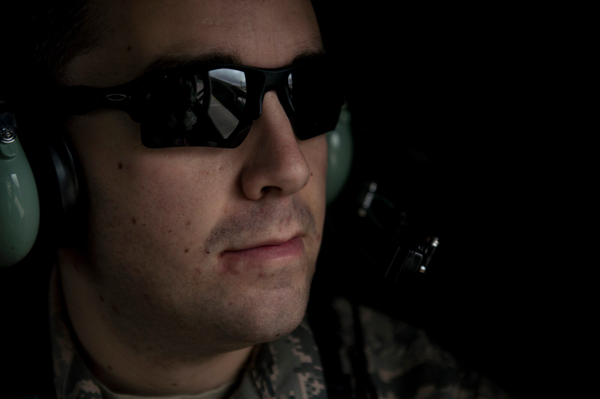 U.S. Air Force Staff Sgt. Paul Orosz, a 52nd Civil Engineer Squadron explosive ordnance disposal craftsman, looks out the window of a UH-60 Black Hawk helicopter during readiness training Nov. 12, 2015, at Spangdahlem Air Base, Germany. Members of Spangdahlem Air Base traveled to the 701st Munitions Support Squadron, Kleine Brogel Air Base, Belgium, to participate in training. (U.S. Air Force photo by Senior Airman Rusty Frank/Released)