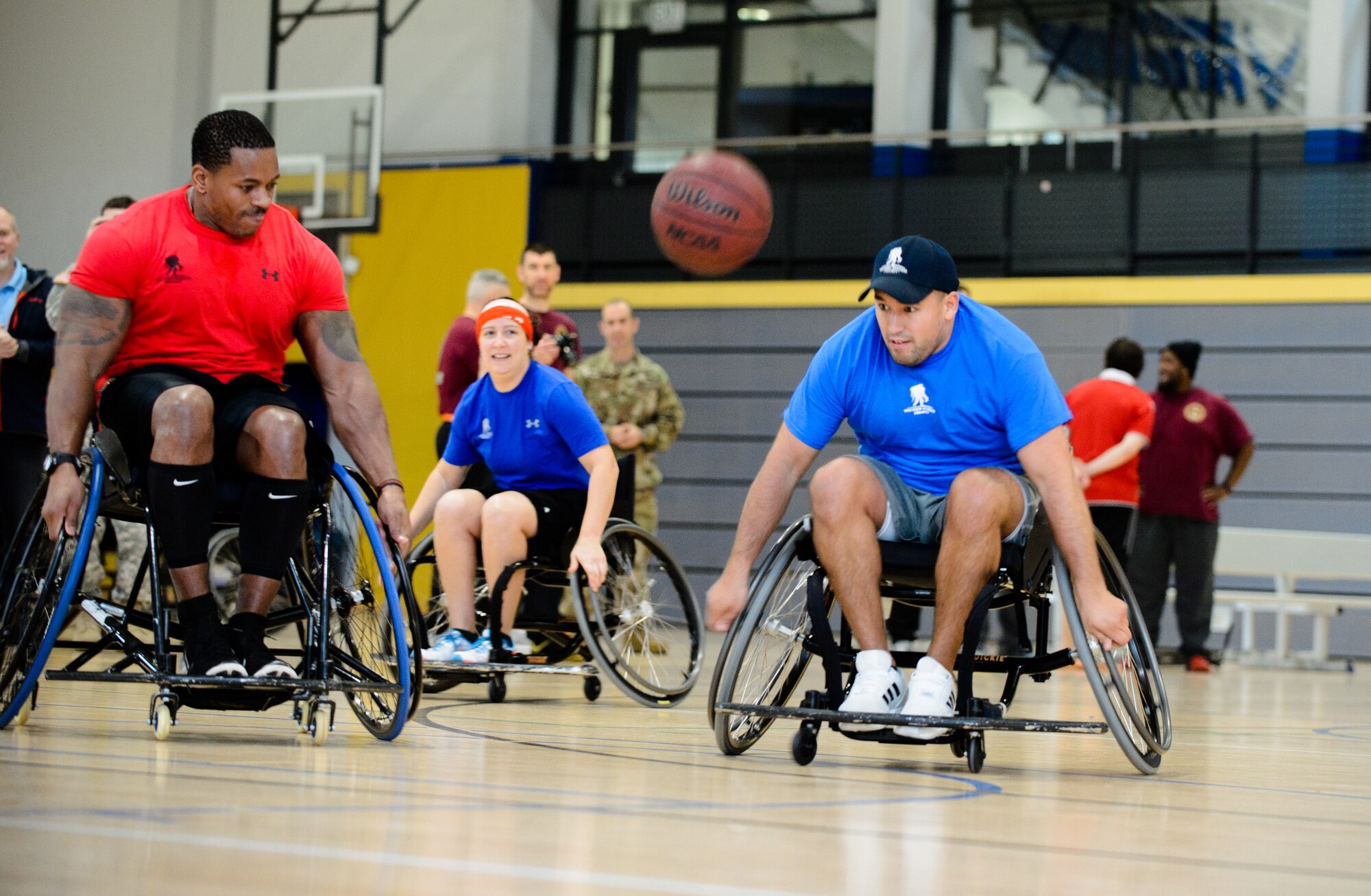Members of the 10th Expeditionary Aeromedical Evacuation Flight and Alpha Company, Warrior Transition Battalion teams chase after a ball during a tournament Nov. 13, 2015. Airmen and Soldiers came together to spread awareness and understanding of the ways the WTB helps heal service members. (U.S. Air Force photo/Staff Sgt. Armando A. Schwier-Morales)