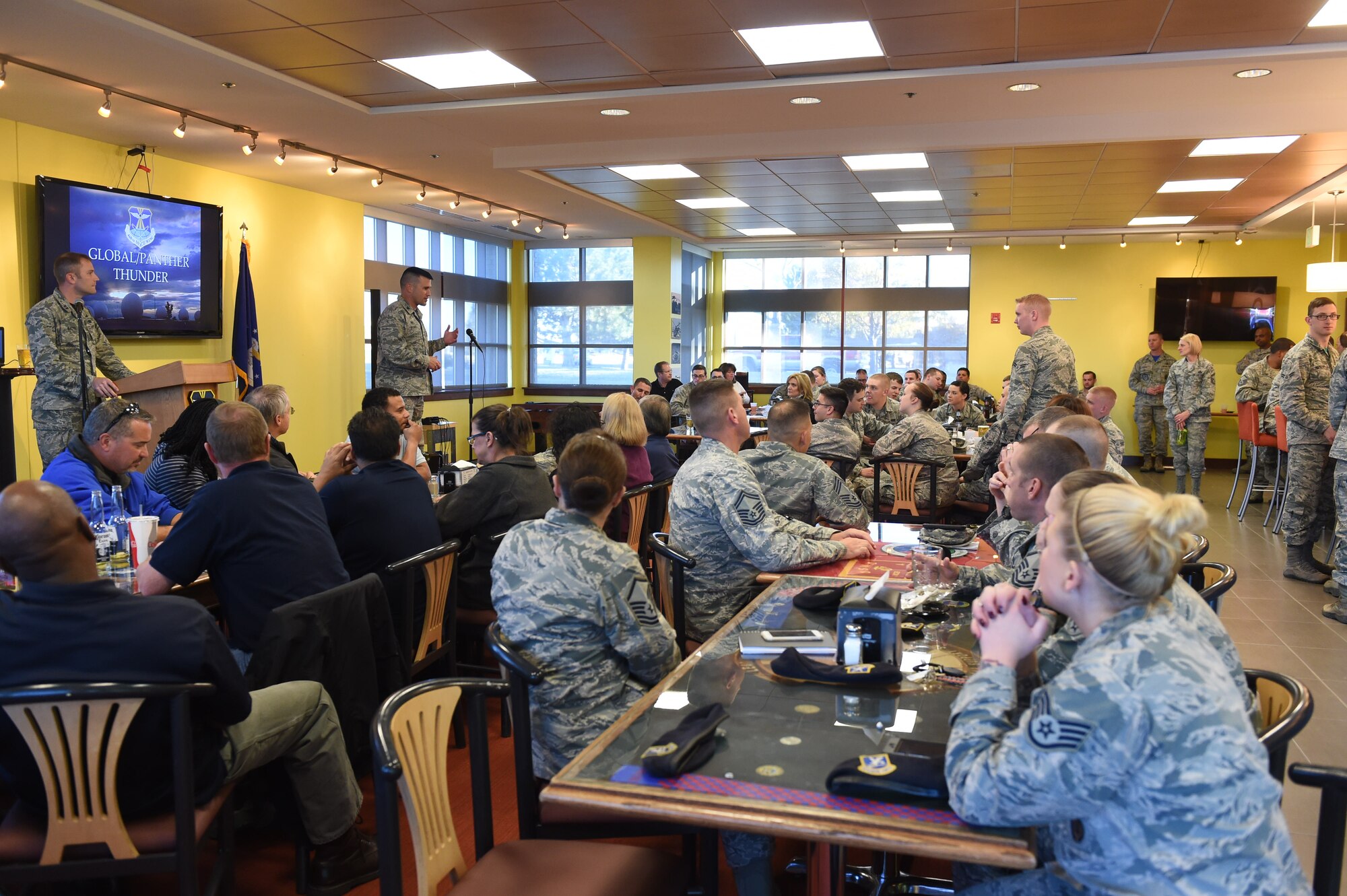 Team Buckley members attend an end of exercise celebration Nov. 13, 2015, at Panther Den on Buckley Air Force Base, Colo. Certificates were awarded to outstanding Team Buckley members for their efforts during Panther Thunder, Buckley AFB’s version of the Strategic Command exercise, Global Thunder. (U.S. Air Force photo by Airman 1st Class Samantha Meadors/Released)
