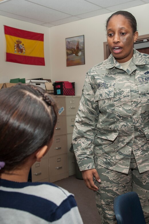 COLORADO SPRINGS, Colo. – Tech. Sgt. Antenette Wise, from Fort Belvoir, Va., discusses with a student at Sabin Middle School what it means to be an Air Force service member. Wise is currently attending Vossler NCO Academy at Peterson Air Force Base and went to Sabin with other VNCOA students to share the importance of Veterans Day and honor those who paved the way and made the Air Force what it is today. (U.S. Air Force photo by Senior Airman Rose Gudex)