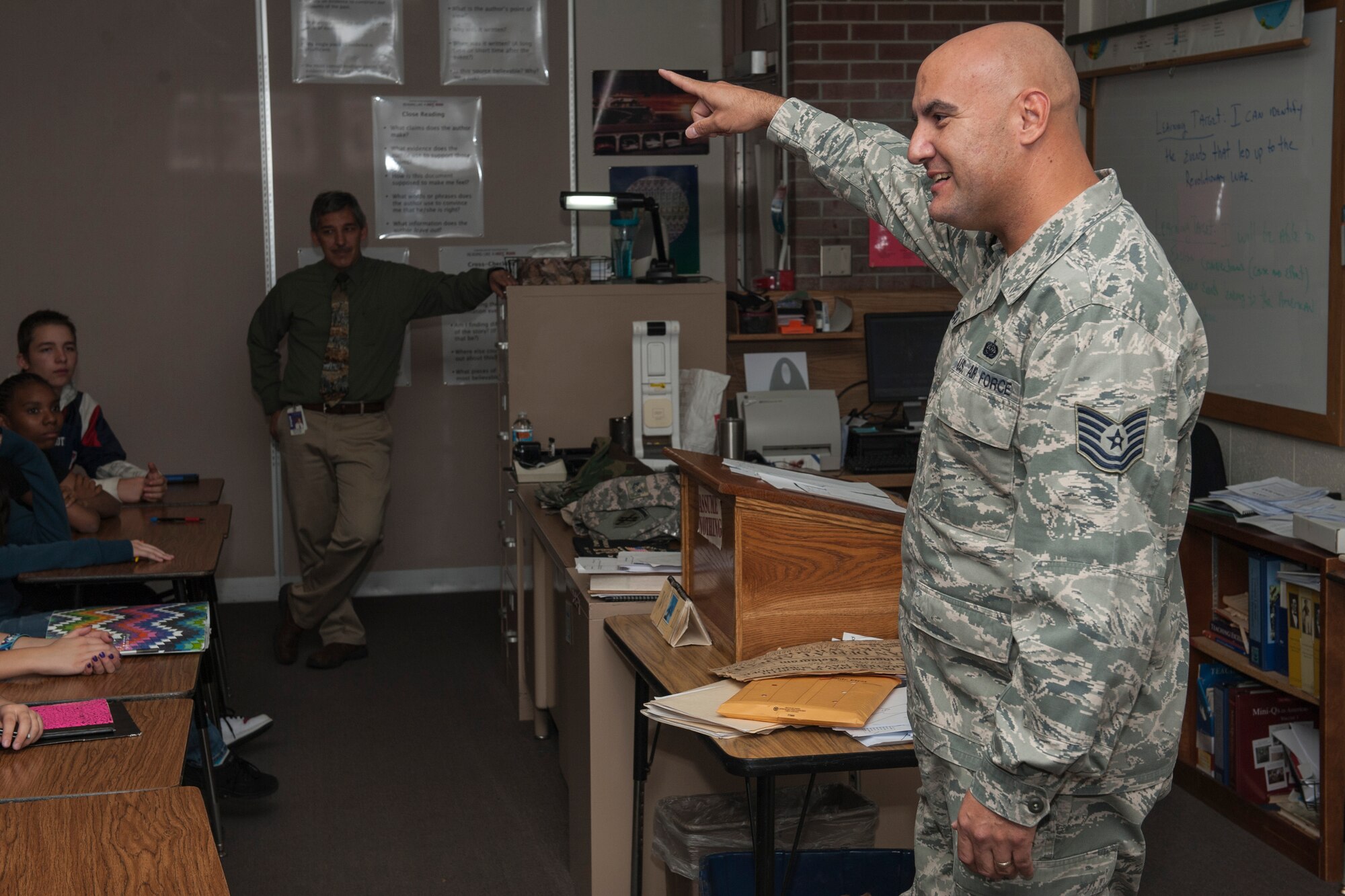 COLORADO SPRINGS, Colo. – Tech. Sgt. Robert Whittaker, 460th Space Communications Squadron at Buckley Air Force Base, Colo., talks to an eighth grade U.S. History class at Sabin Middle School, Nov. 11, 2015 about what it means to be in the military. Whittaker went to Sabin Middle School and also had Mr. Butler for a history teacher. (U.S. Air Force photo by Senior Airman Rose Gudex)