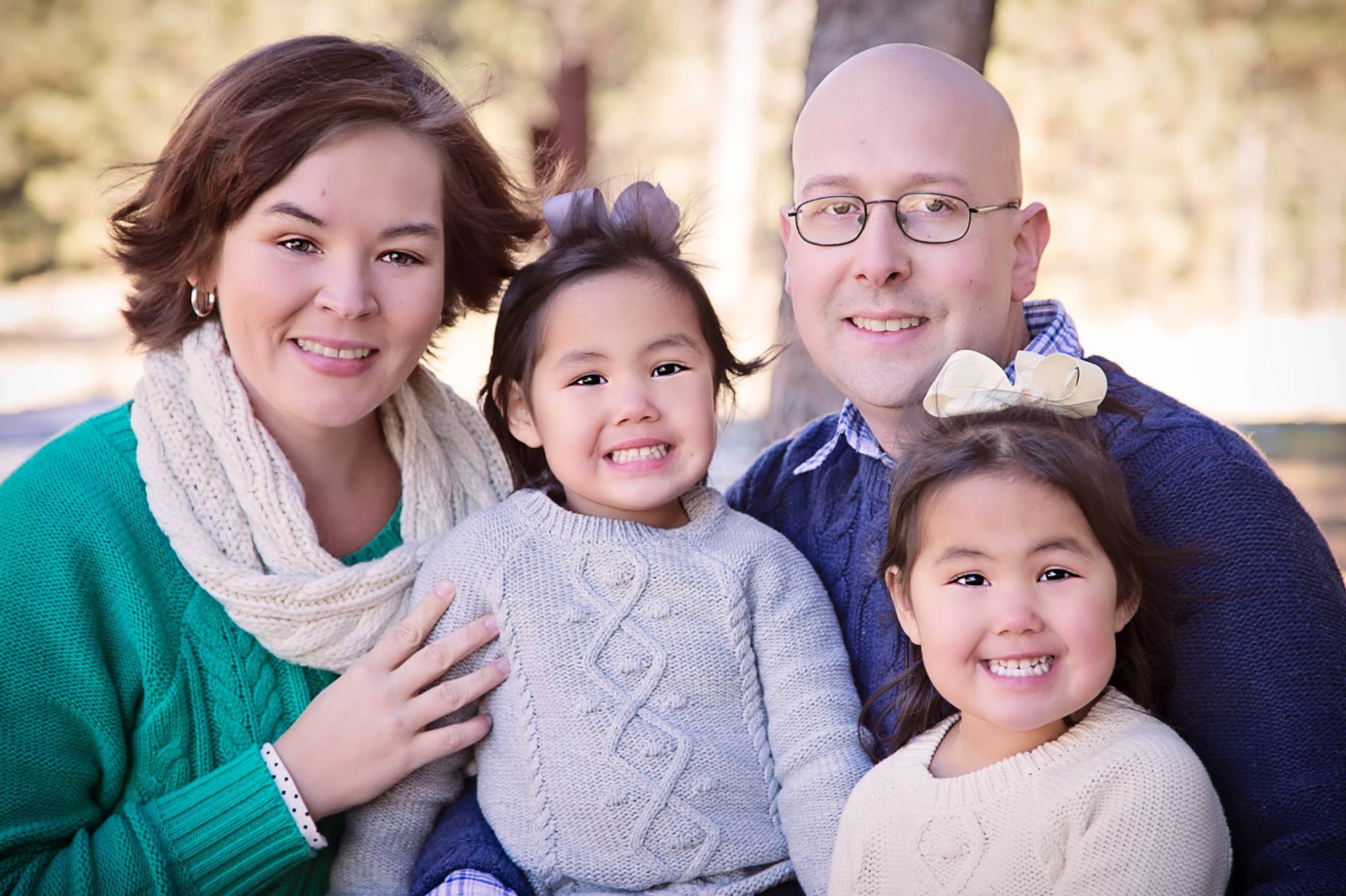 PETERSON AIR FORCE BASE, Colo. - Daughters Hope and Faith surround Army Major Rob Callahan and his wife, Becky, during a family portrait taken in 2014. Callahan lost his right leg to bone cancer in 2004 and after many years of physical therapy was able to pass the Army physical fitness test using a prosthetic leg. (Courtesy photo by Becky Callahan)